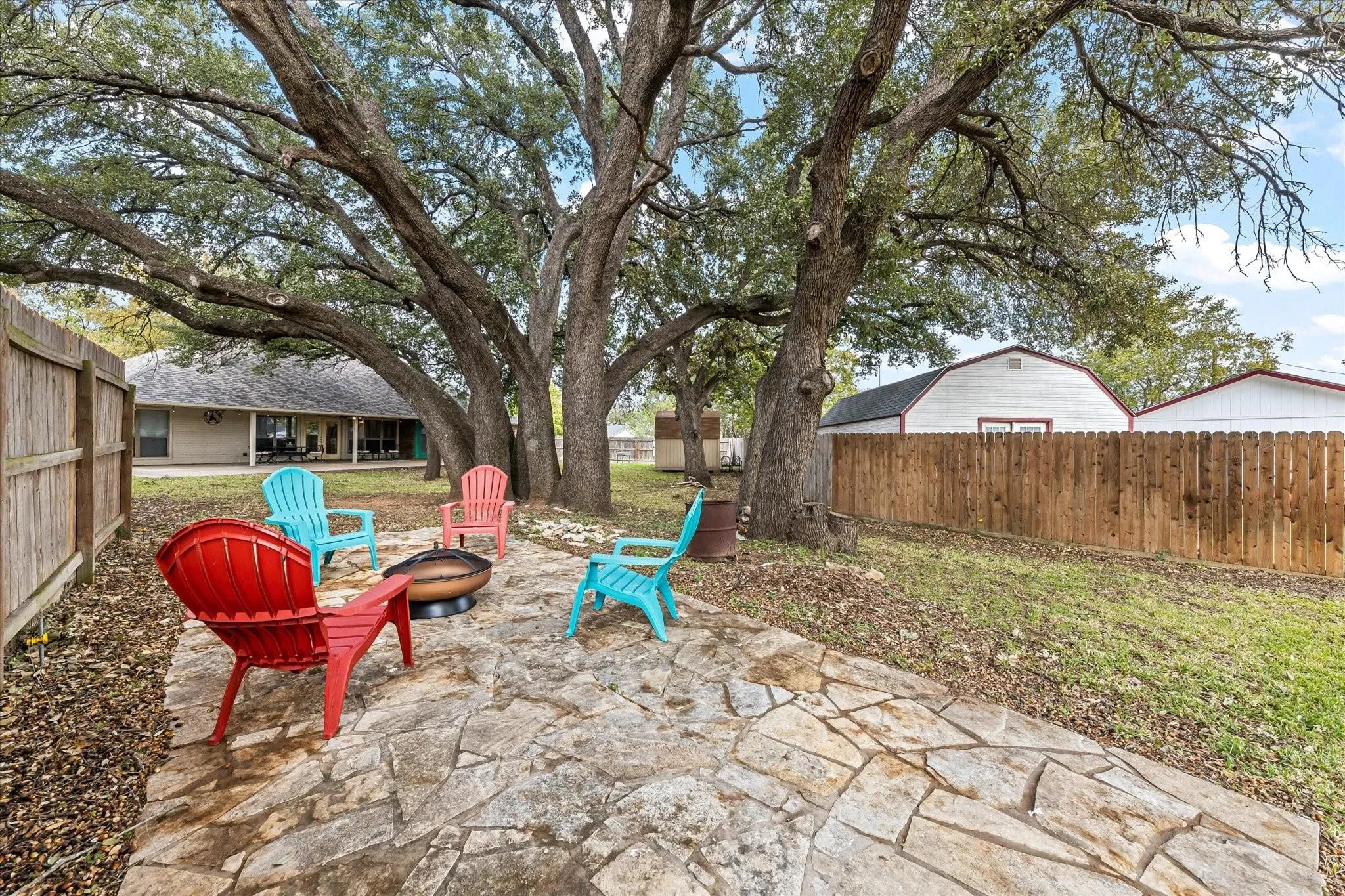 View of patio / terrace with a fire pit and a fenced backyard