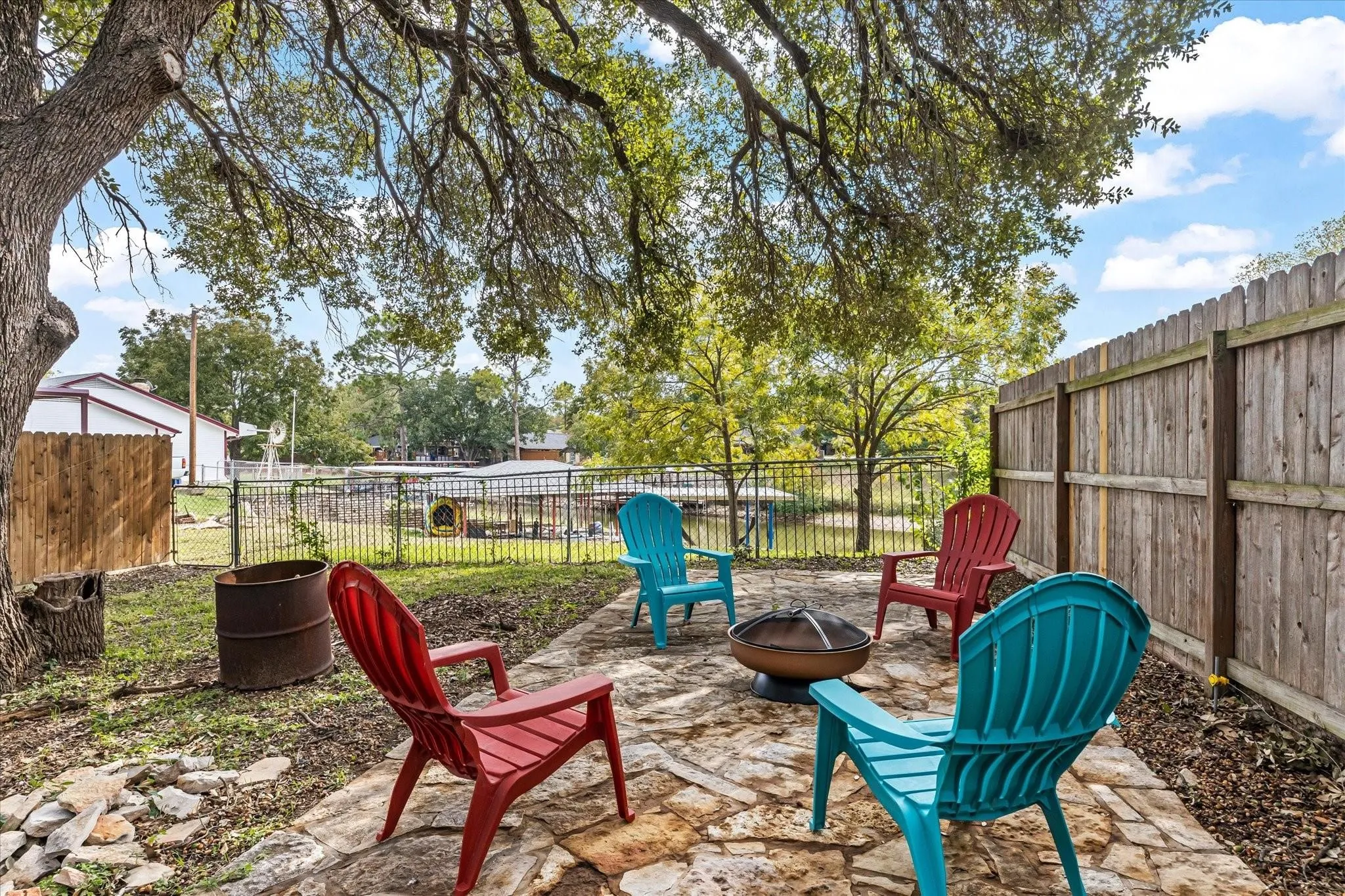 View of patio / terrace with a fenced backyard and a fire pit