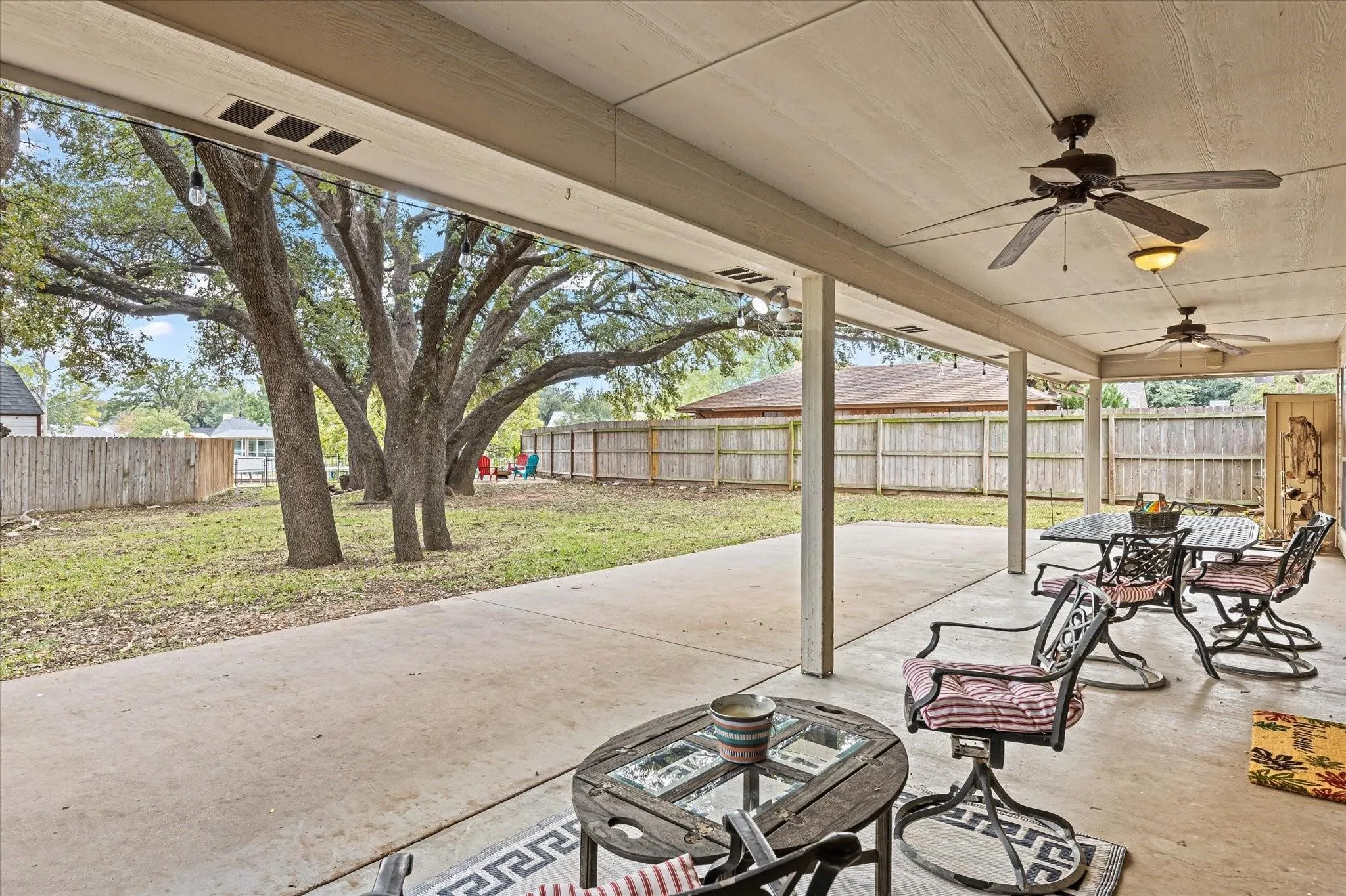 View of patio / terrace with a fenced backyard and a ceiling fan