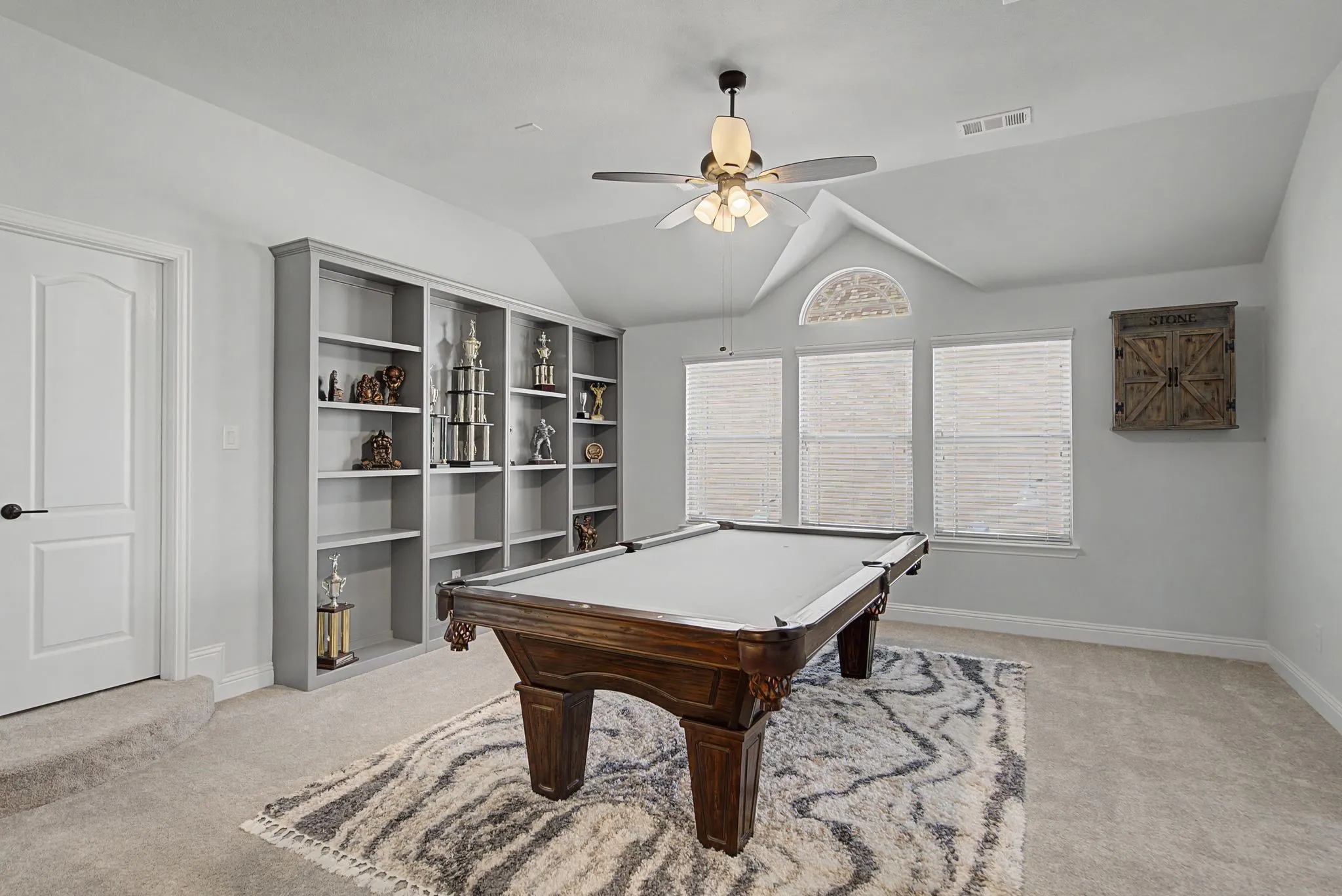 Rec room featuring a ceiling fan, pool table, vaulted ceiling, and carpet