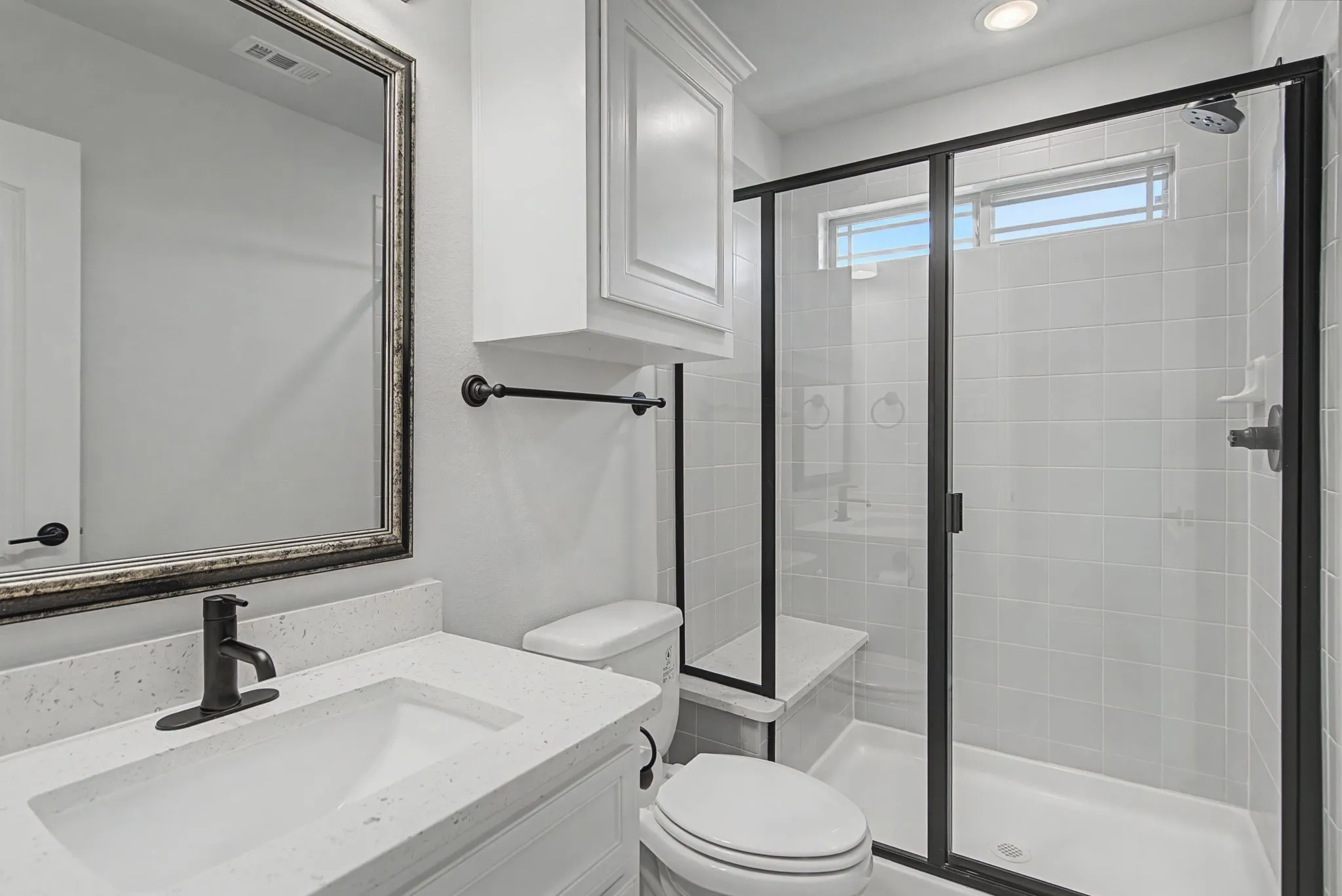 Full bath with vanity and a stall shower