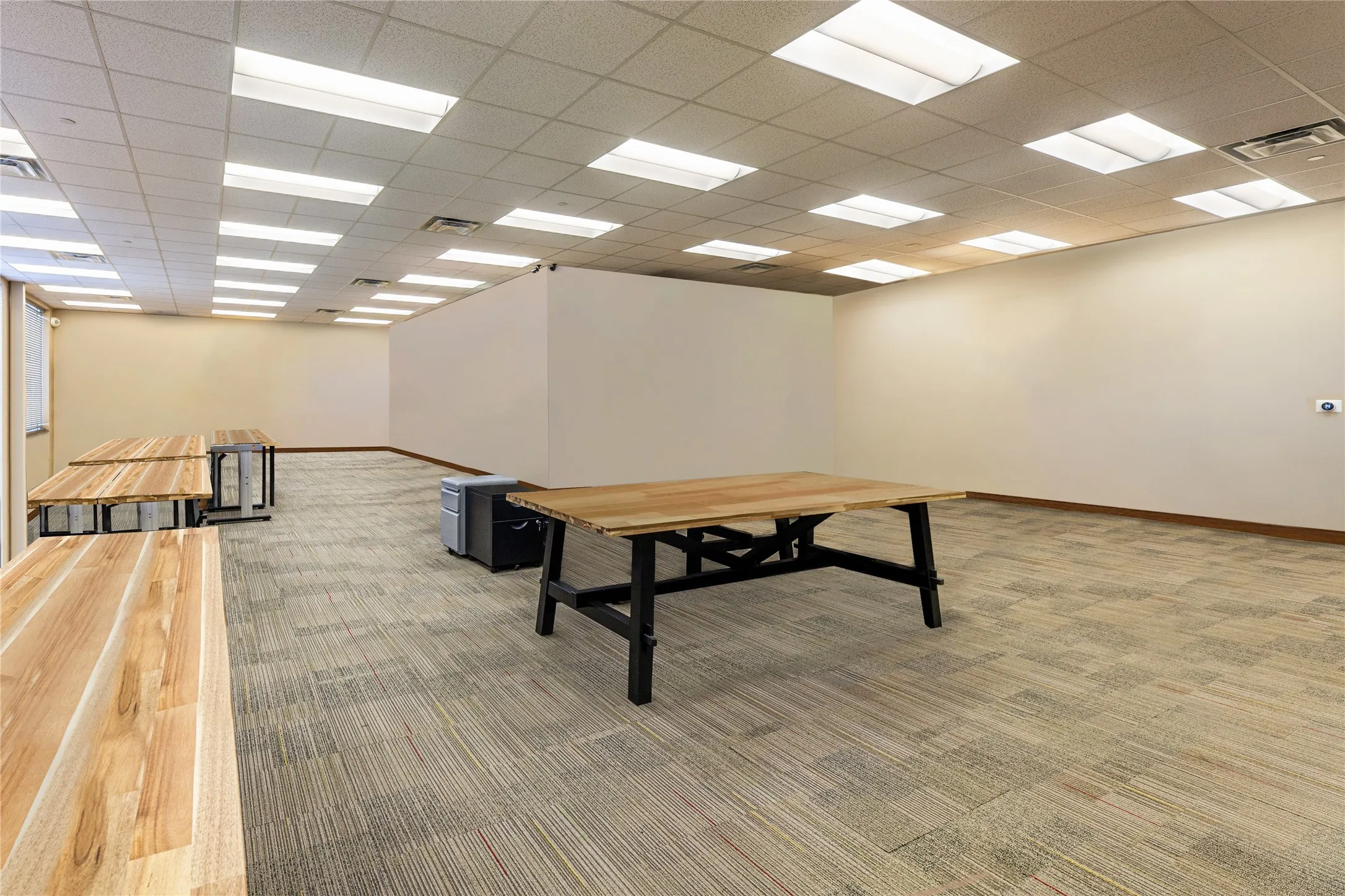 Miscellaneous room featuring a paneled ceiling and carpet flooring