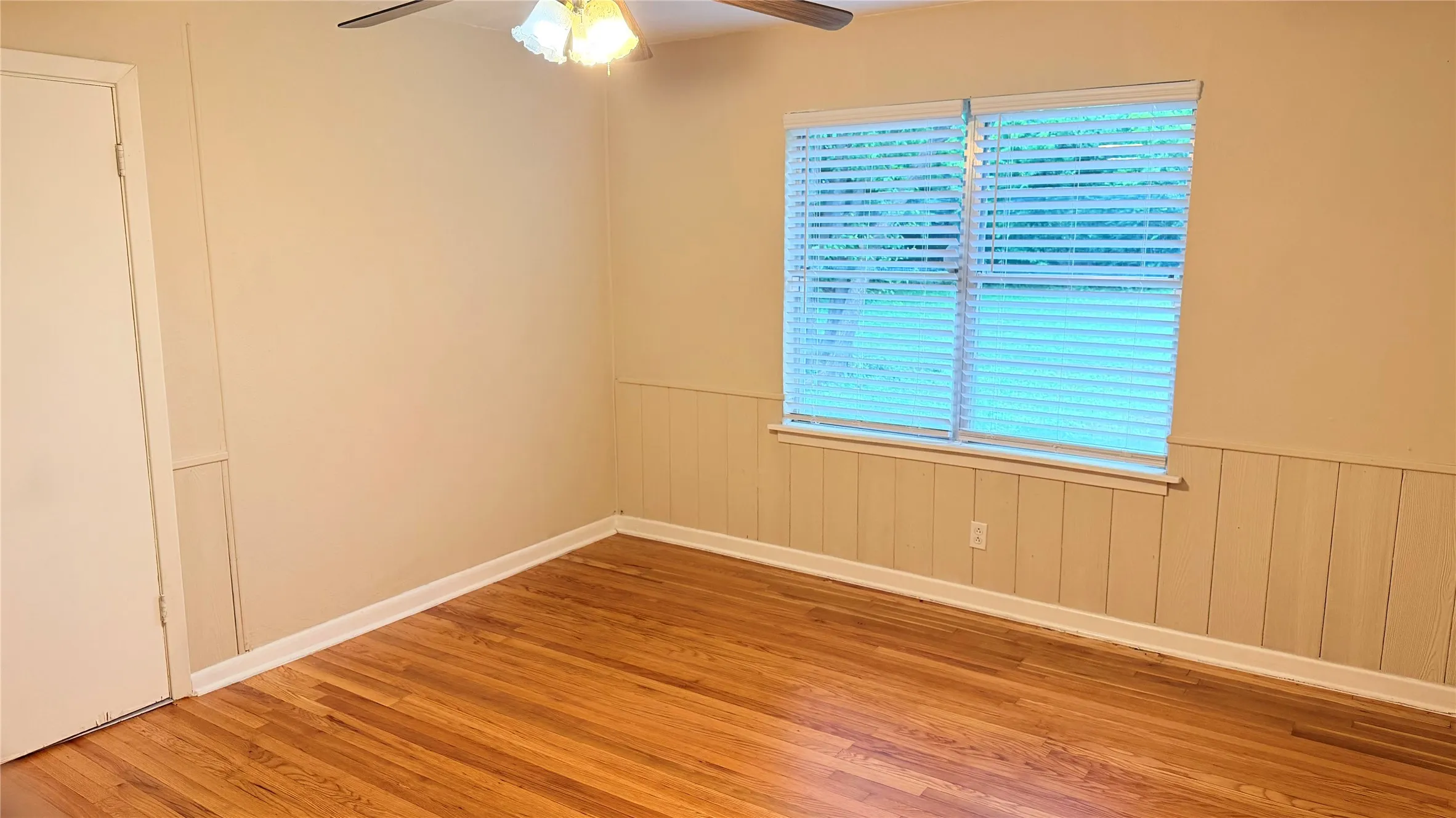 Hardwood flooring extending throughout the room
