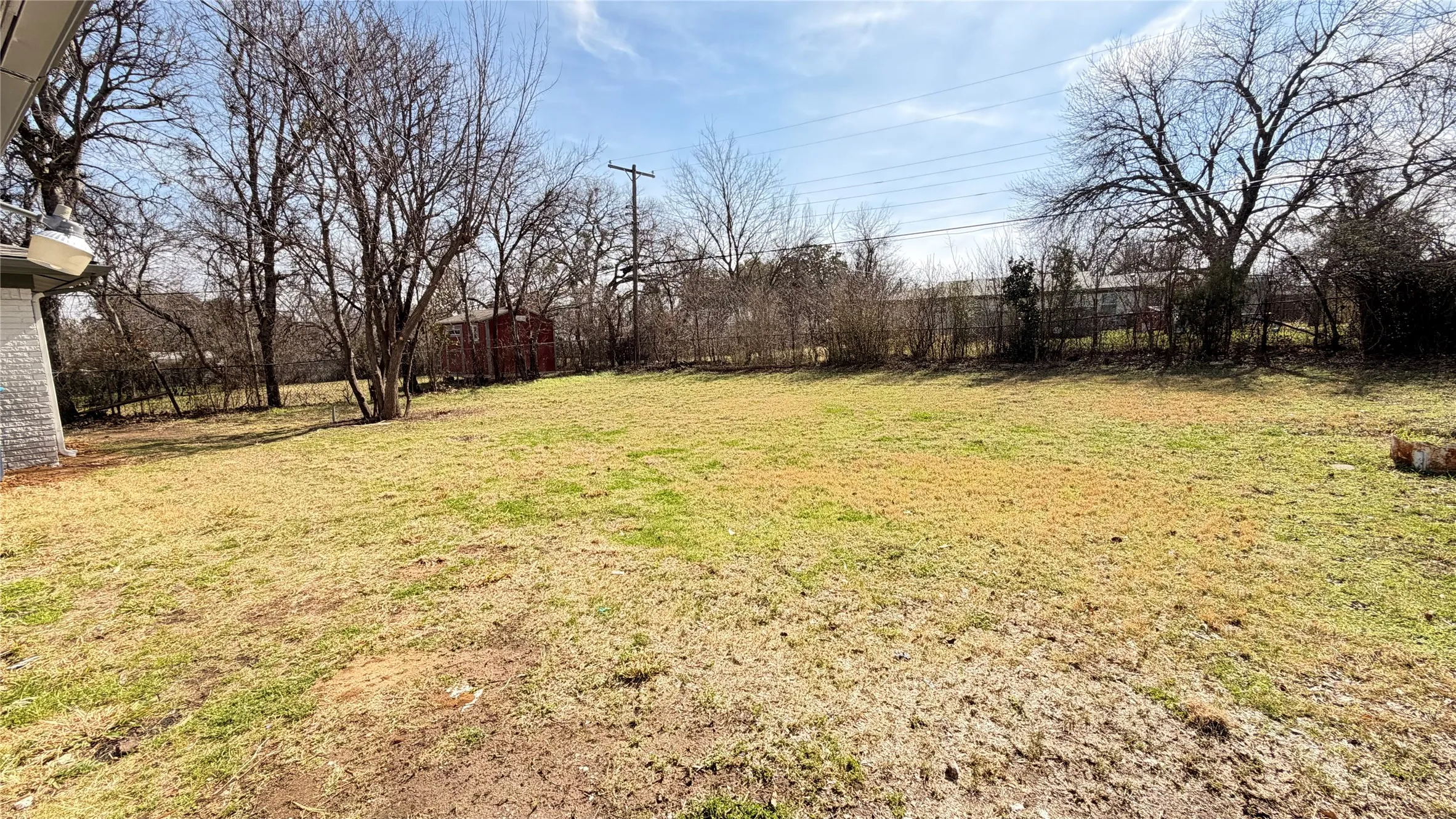 Expansive outdoor space featuring a large lawn area