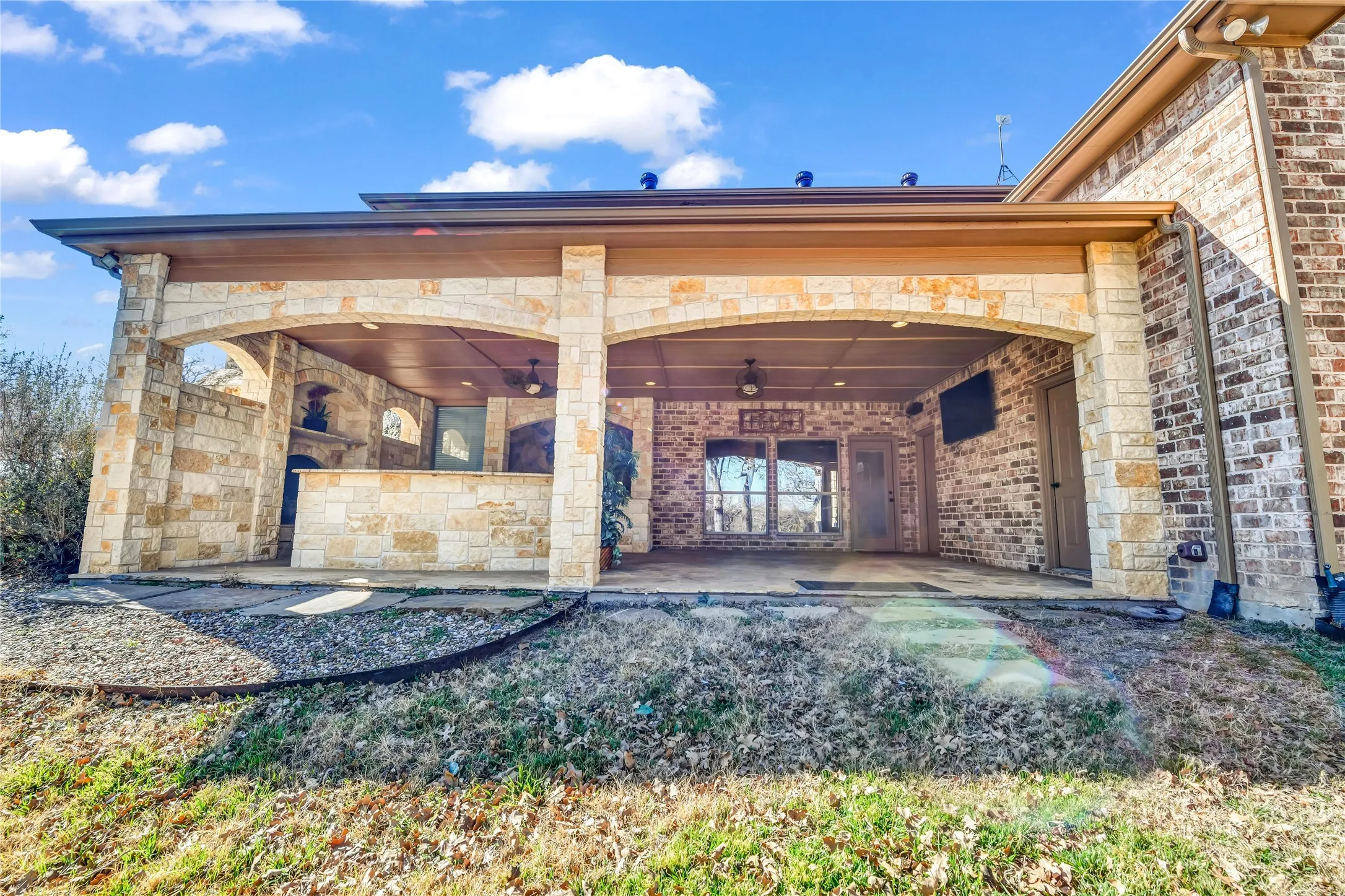 Patio with fireplace and kitchen