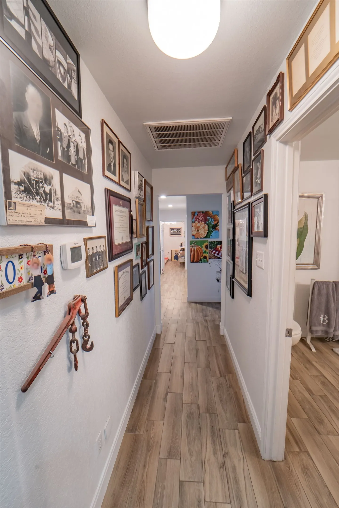 Hallway leading to guest wing-offering privacy in a split floor plan