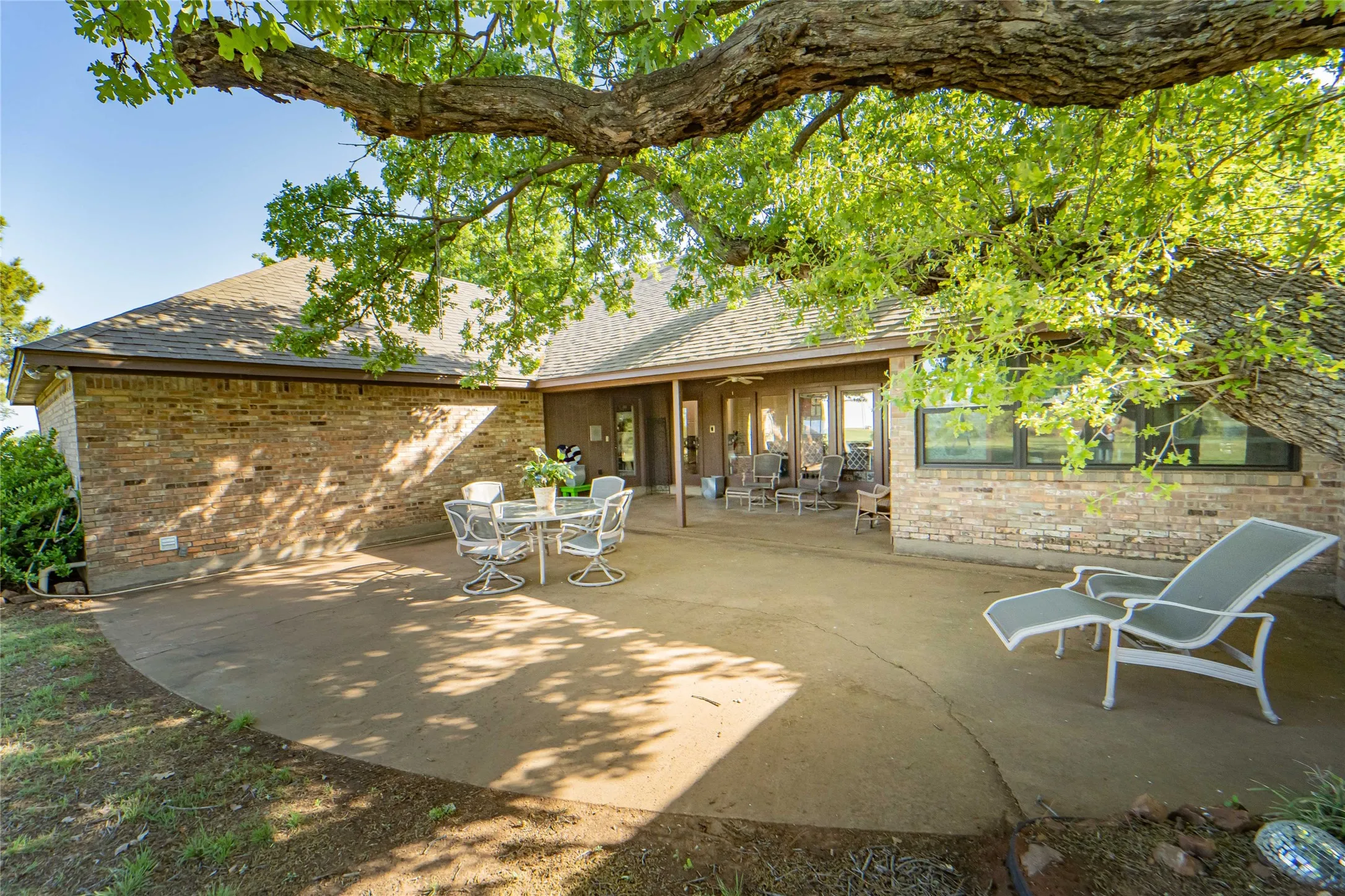 Dining area, primary bedroom and guest wing all wrap this covered patio and outdoor courtyard-offering 3 points of access from the property- offering options for enjoying morning coffee, dining alfresco or sipping a glass of your favorite!