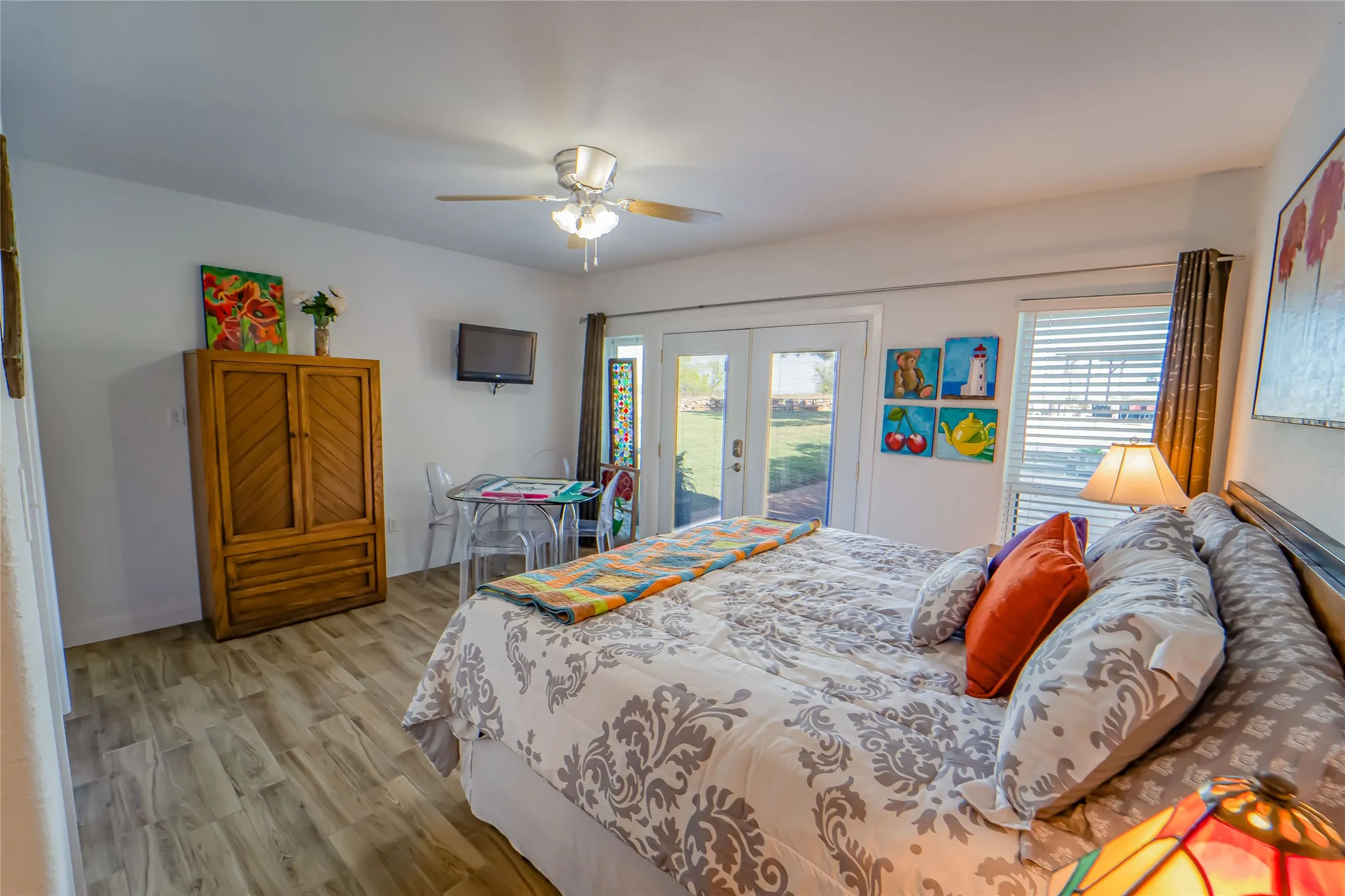 Guest wing bedroom (#4) -great windows and access to outdoor pool and pavilion area-