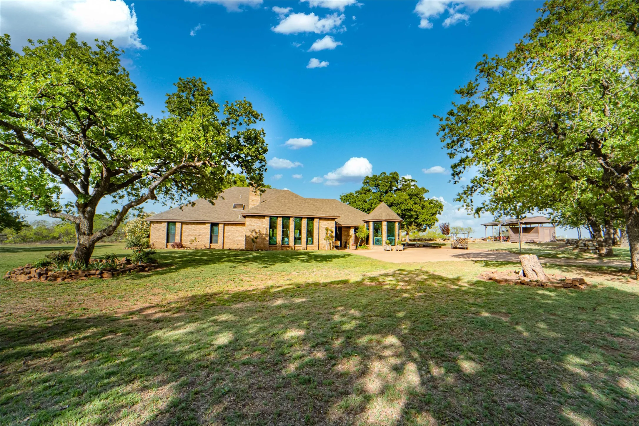 Beautifully maintained 4 bedroom, 3 bath estate, gorgeous mature oak trees-offers rare privacy, minutes from town-outside city limits!