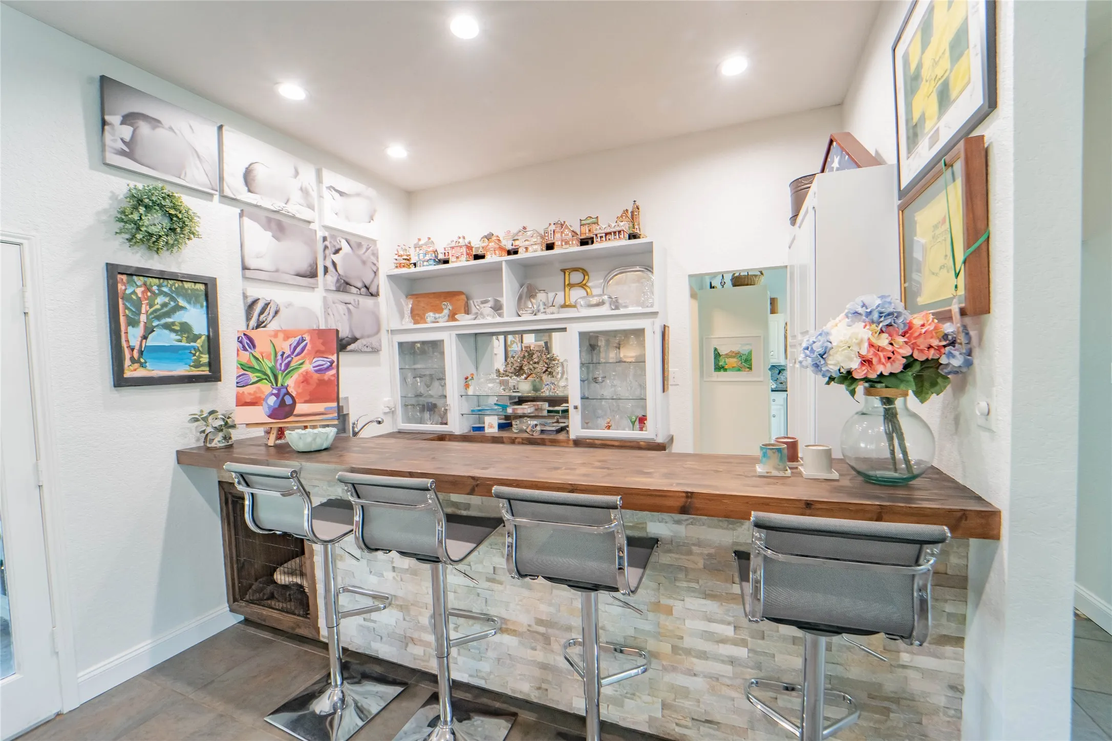 Wet bar, conveniently located between living area, dining area and kitchen with quick access to outdoor covered patio-awesome for hosting