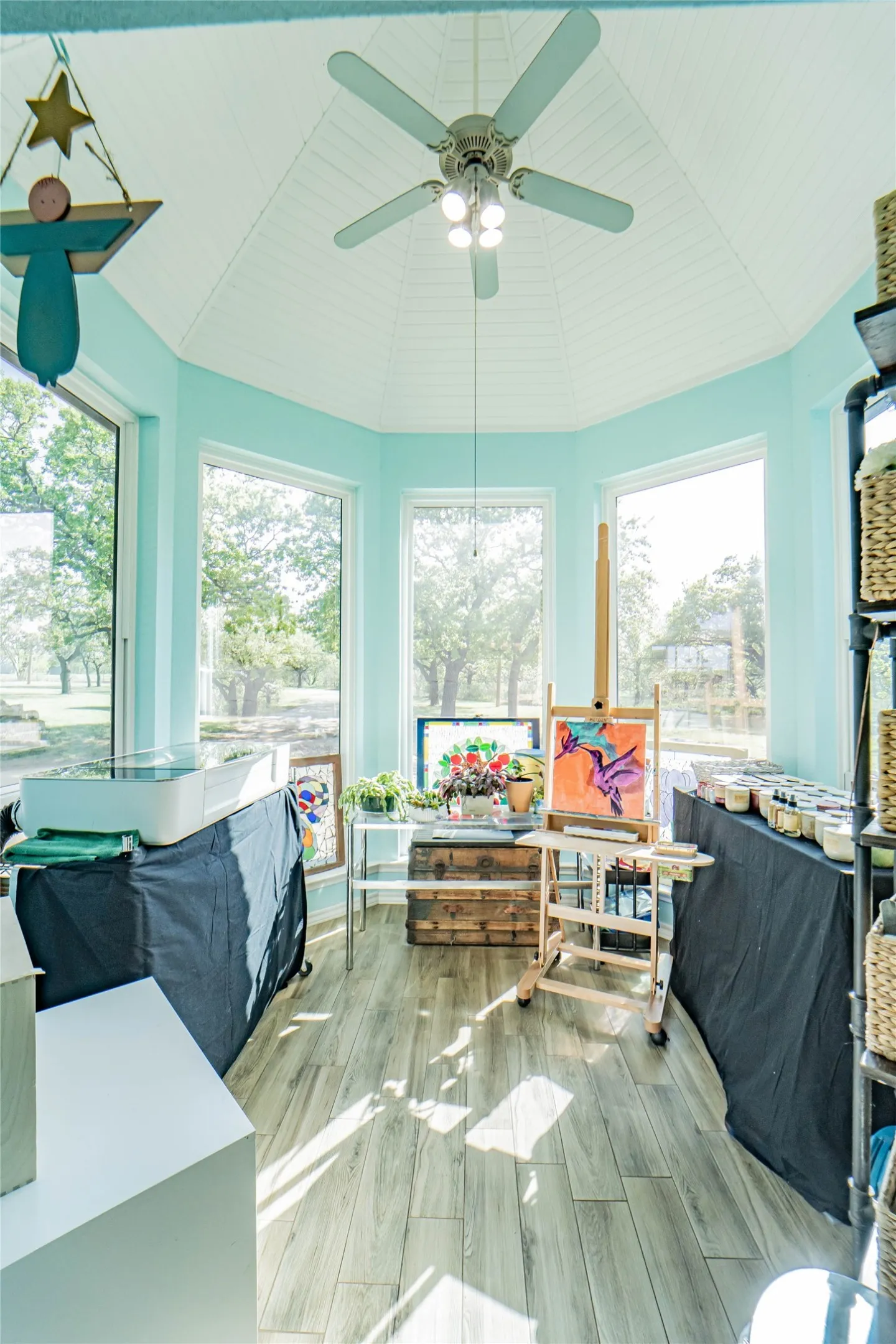 Very unique breakfast nook or sunroom, currently doubling as an art studio-this space has a vaulted hexagon shaped ceiling and offers the most beautiful, wooded views of nature!