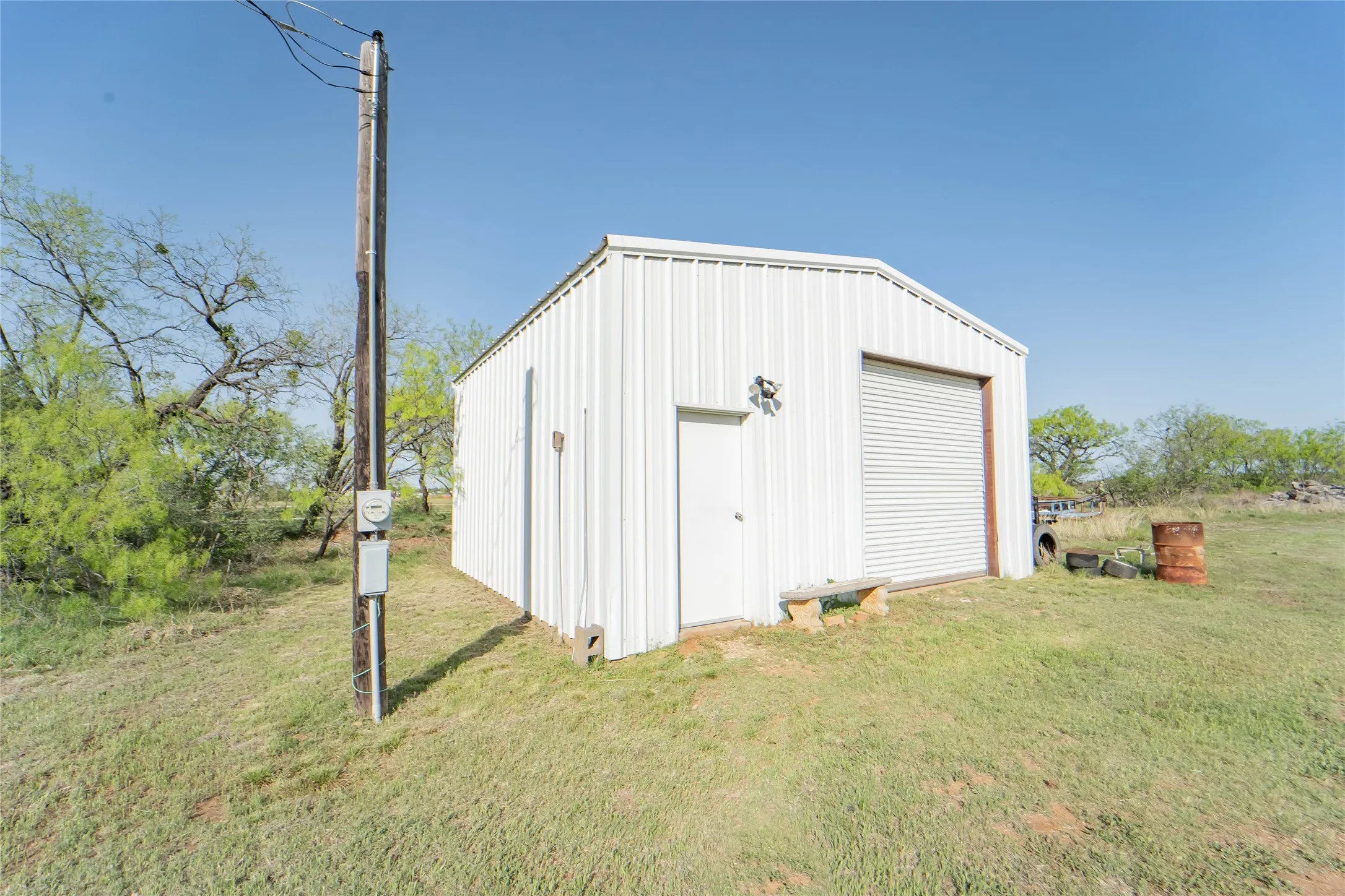 Metal workshop, 24x24, with electricity and concrete flooring allows for projects, equipment and storage!