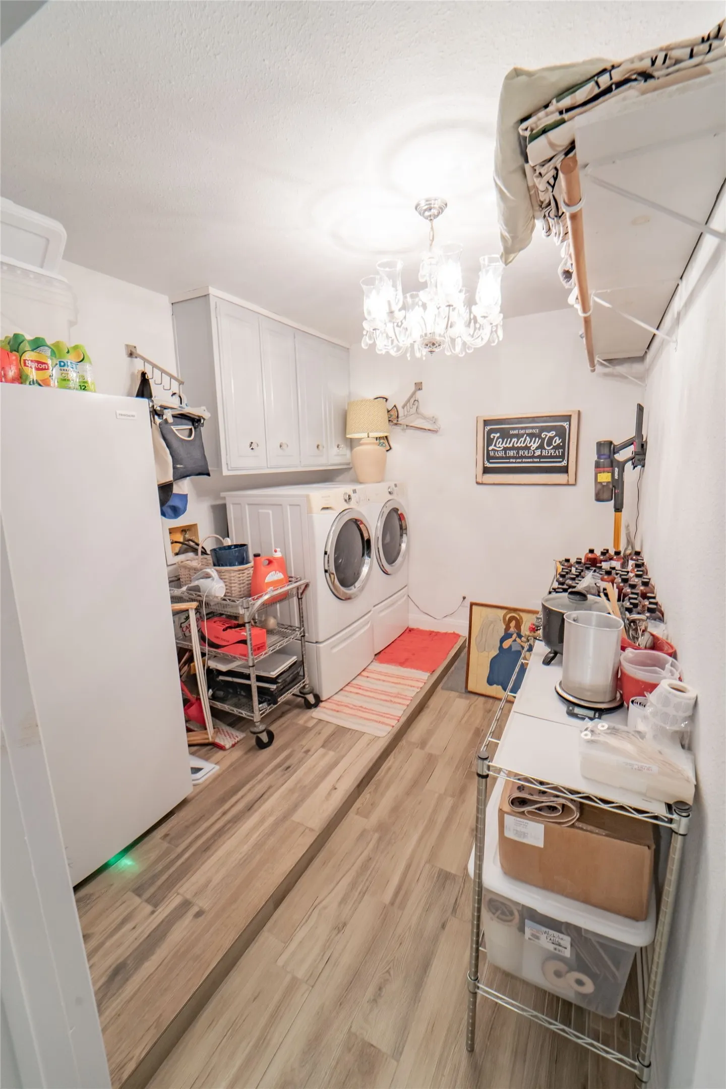 Laundry area is a workhorse, with full sized washer and dryer, builtins, hanging space and room for a freezer!