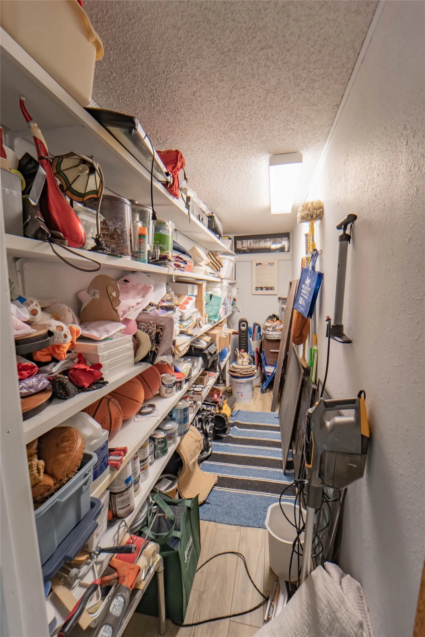 Large storage room located conveniently off the kitchen-great potential for a butler's pantry!