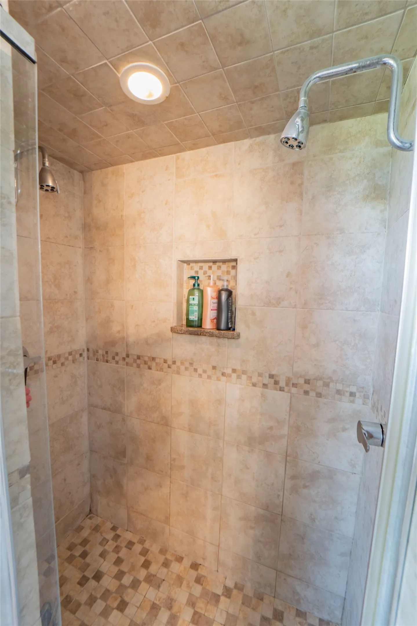Spa-Like Primary En-Suite offers custom tiled walk in shower and heated towel bar-
