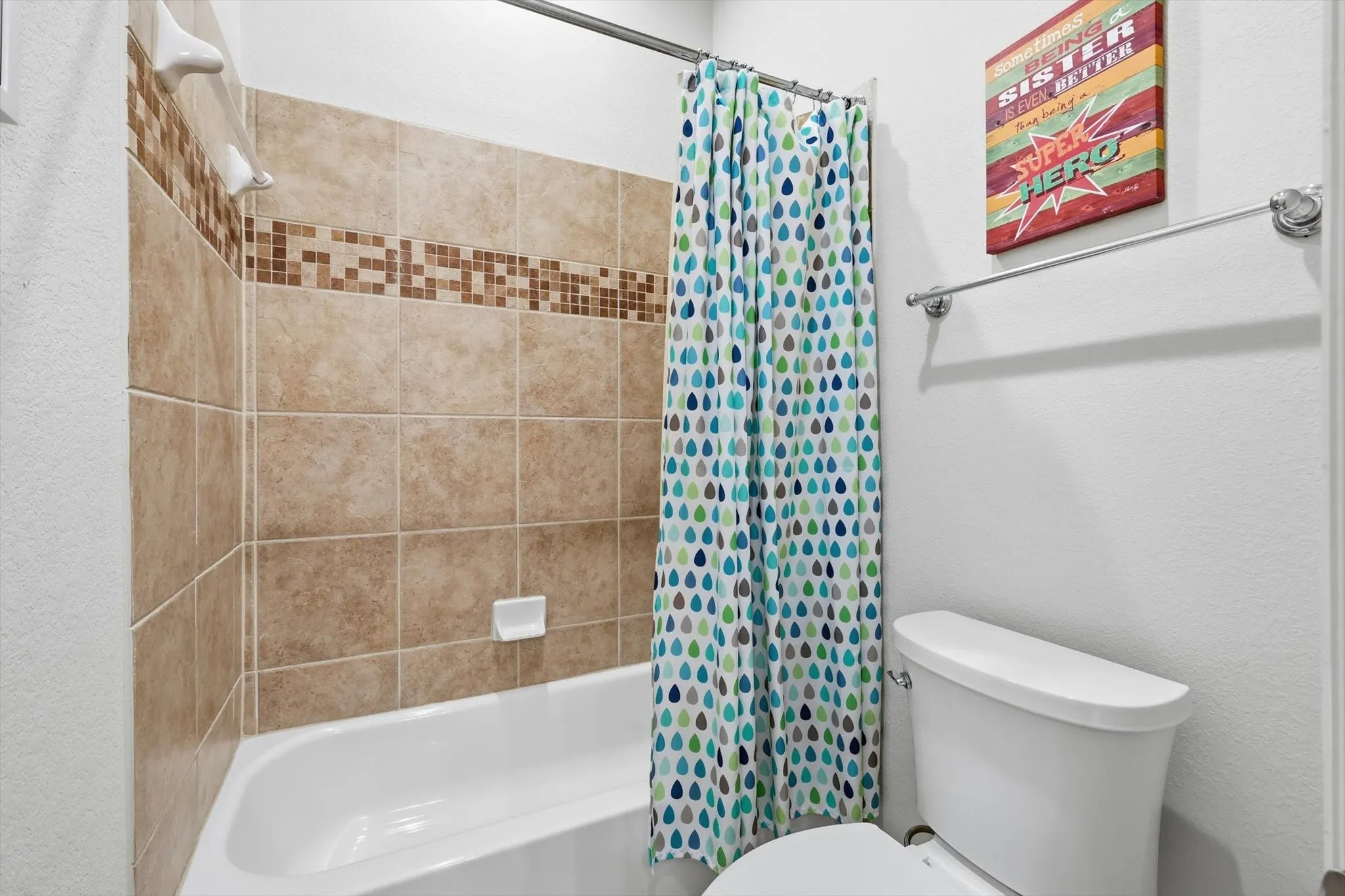 Full Jack & Jill bathroom featuring shower / tub combo