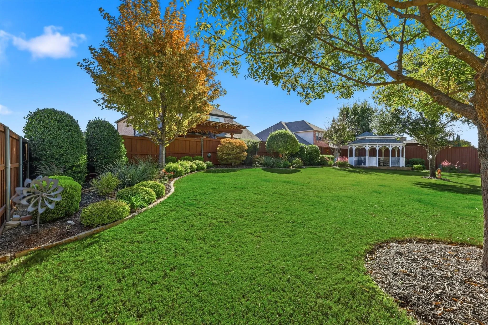View of fenced backyard