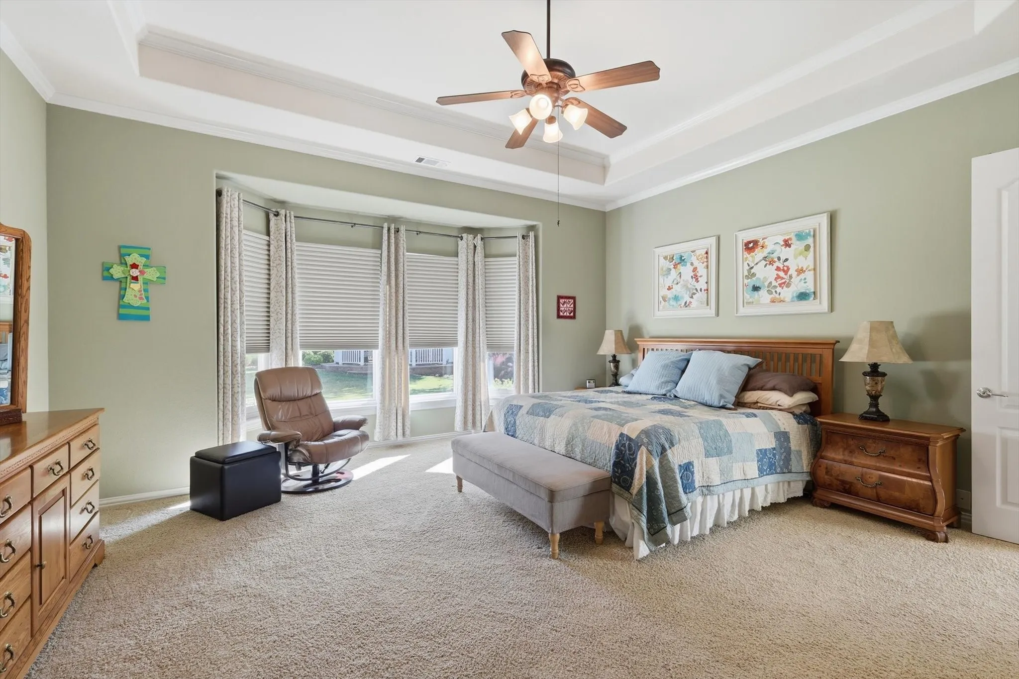 Primary Bedroom with a sitting area by Bay Window