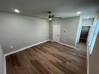 Both bedroom in  bedroom unit with ceiling fan, hard surface floors and near garage