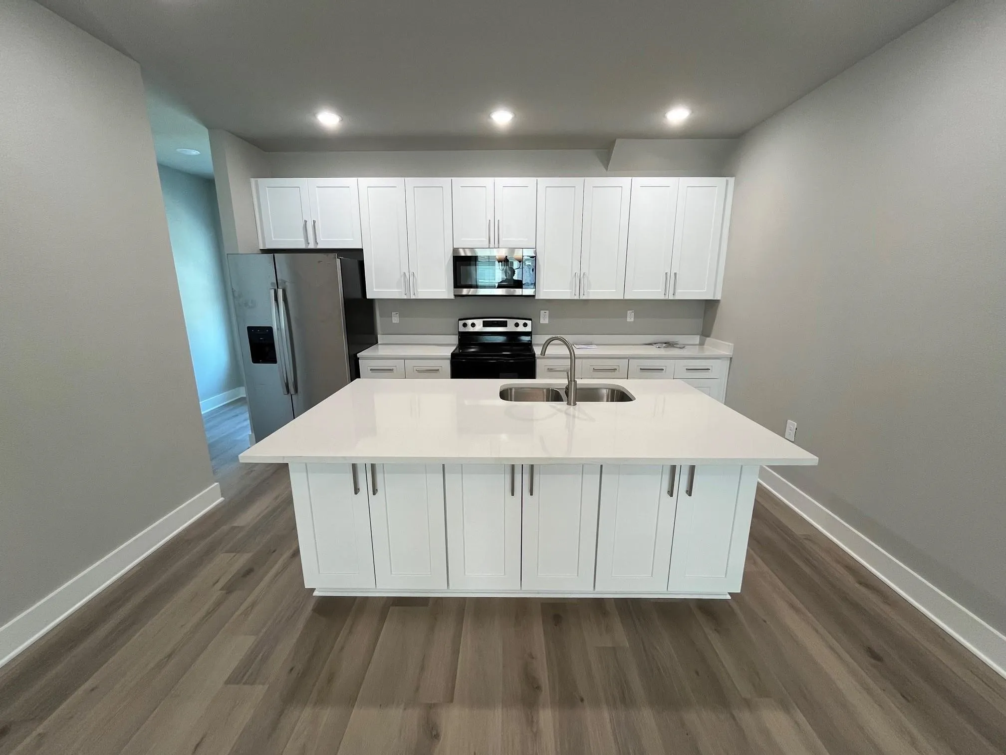 Kitchen in the 3 bedroom unit with granite counter space, lots of cabinets and coutner space