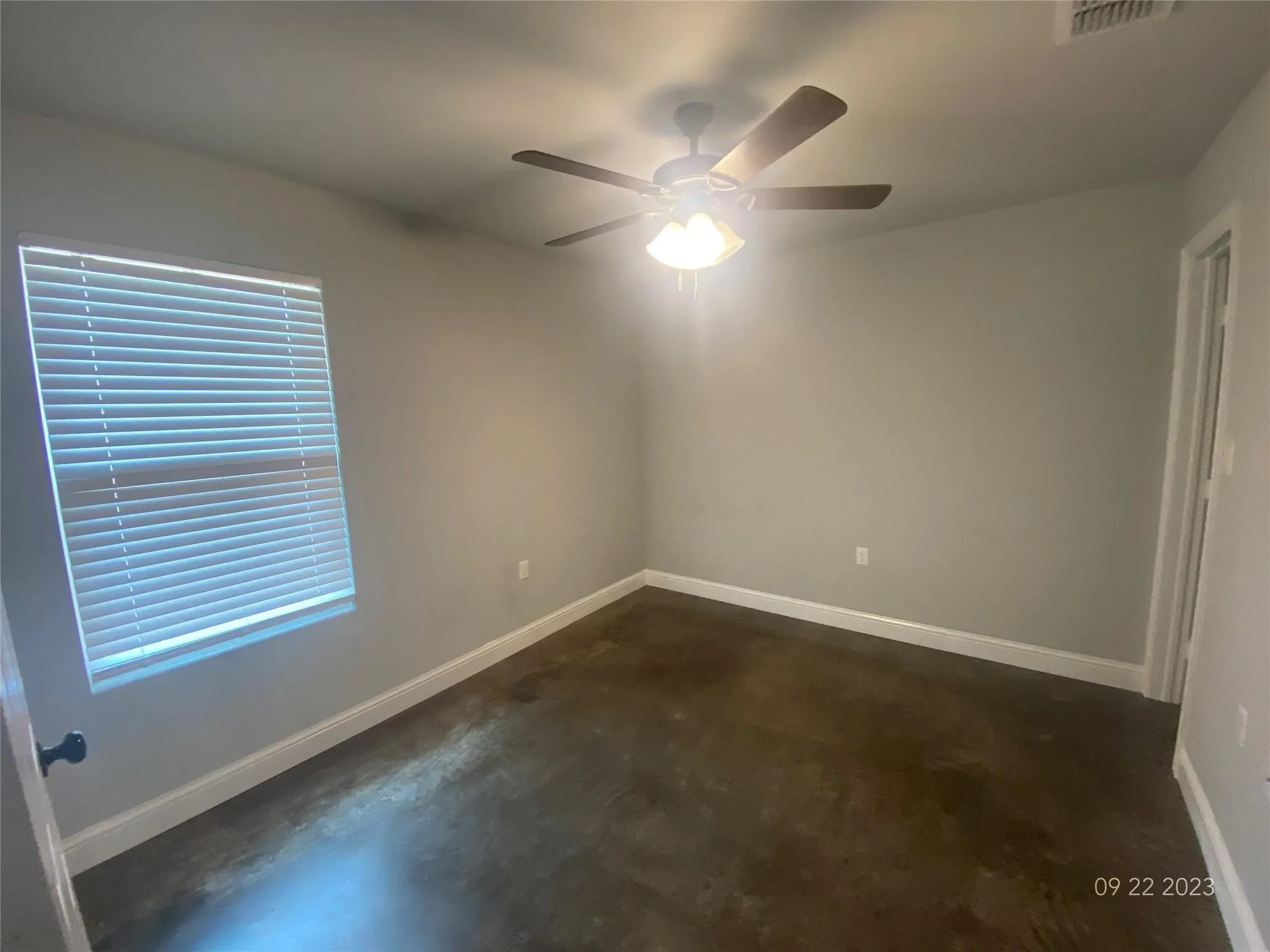 Downstairs bedroom that looks to back yard and fenced areas