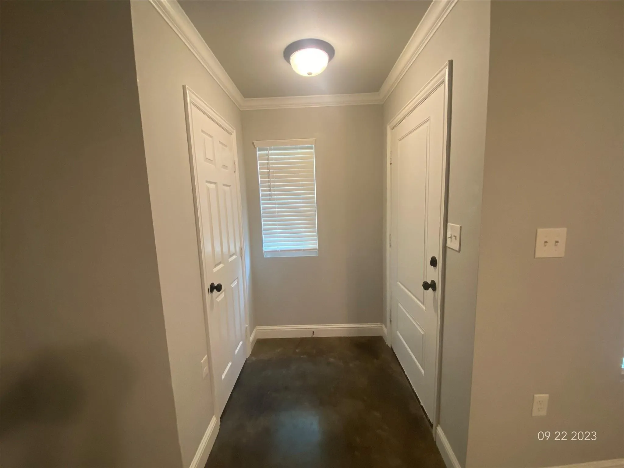 Entrance to living area with a coat clost