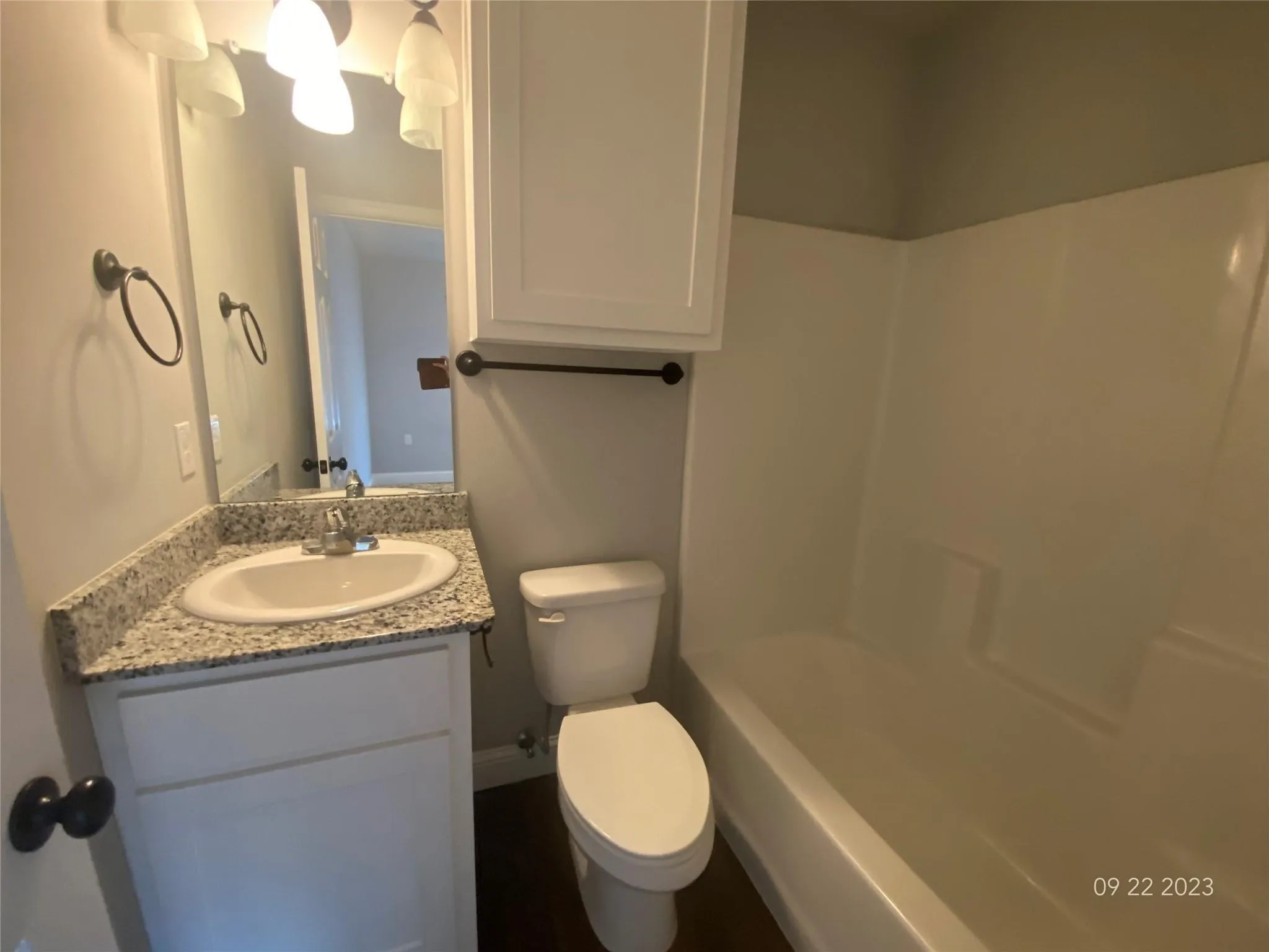 Upstairs bathroom with tub/shower combination, under sink cabinet and l