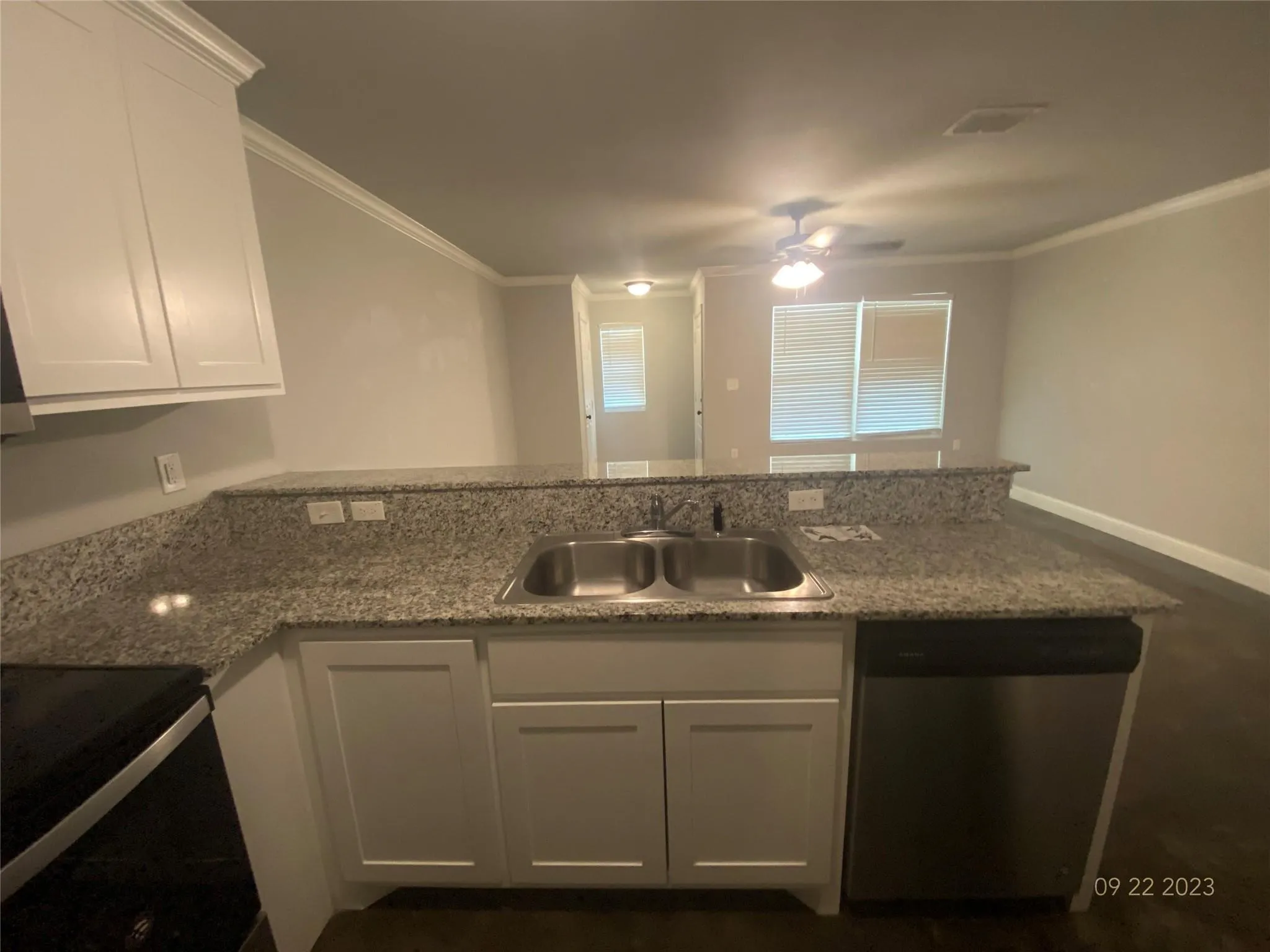 Kitchen has dual sink, refrigerator, stove, and dishwasher