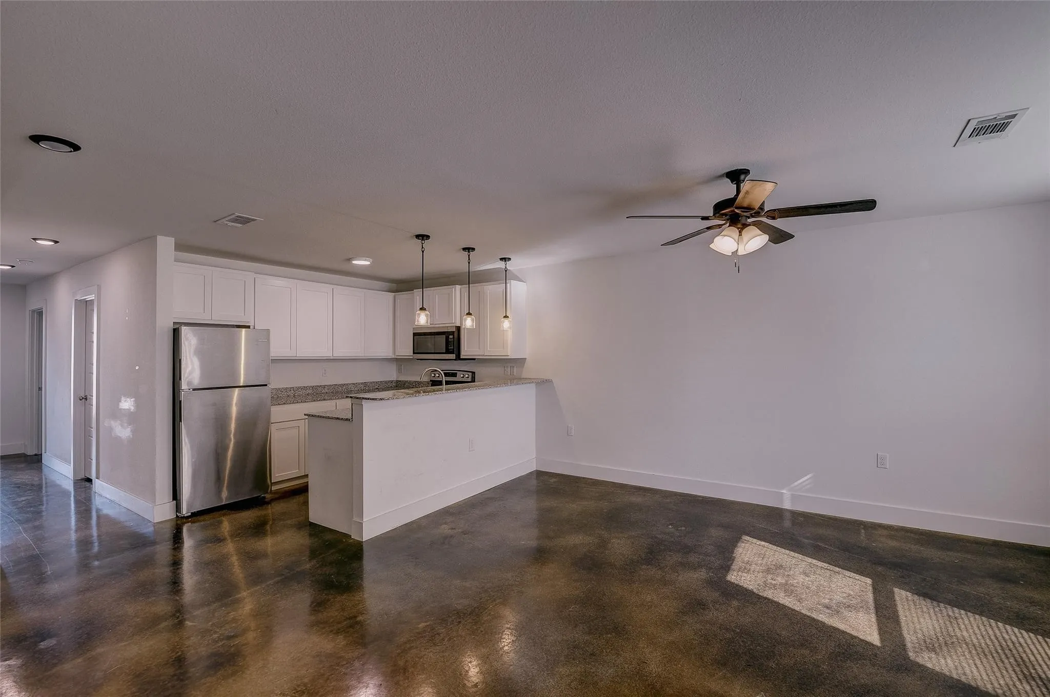 Kitchen has dishwasher, microwave, stove and refrigerator