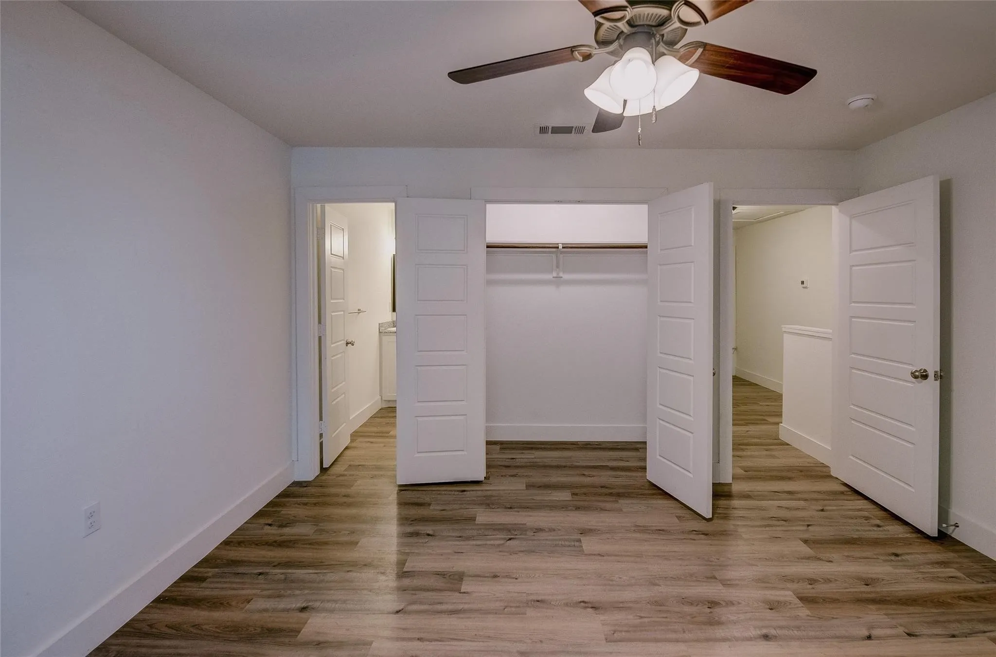 Large bedroom with great closet space and ceiling fan