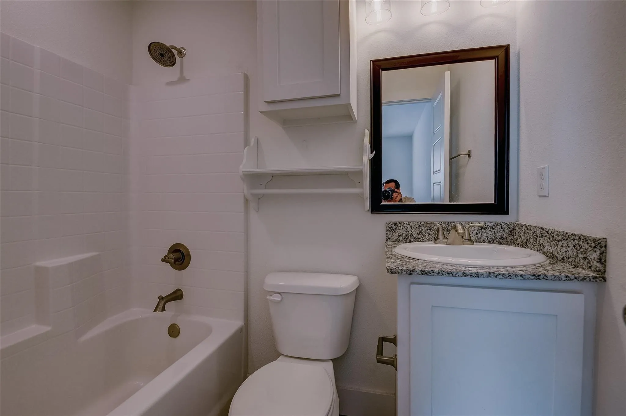 Tub/shower in bathroom and linen area
