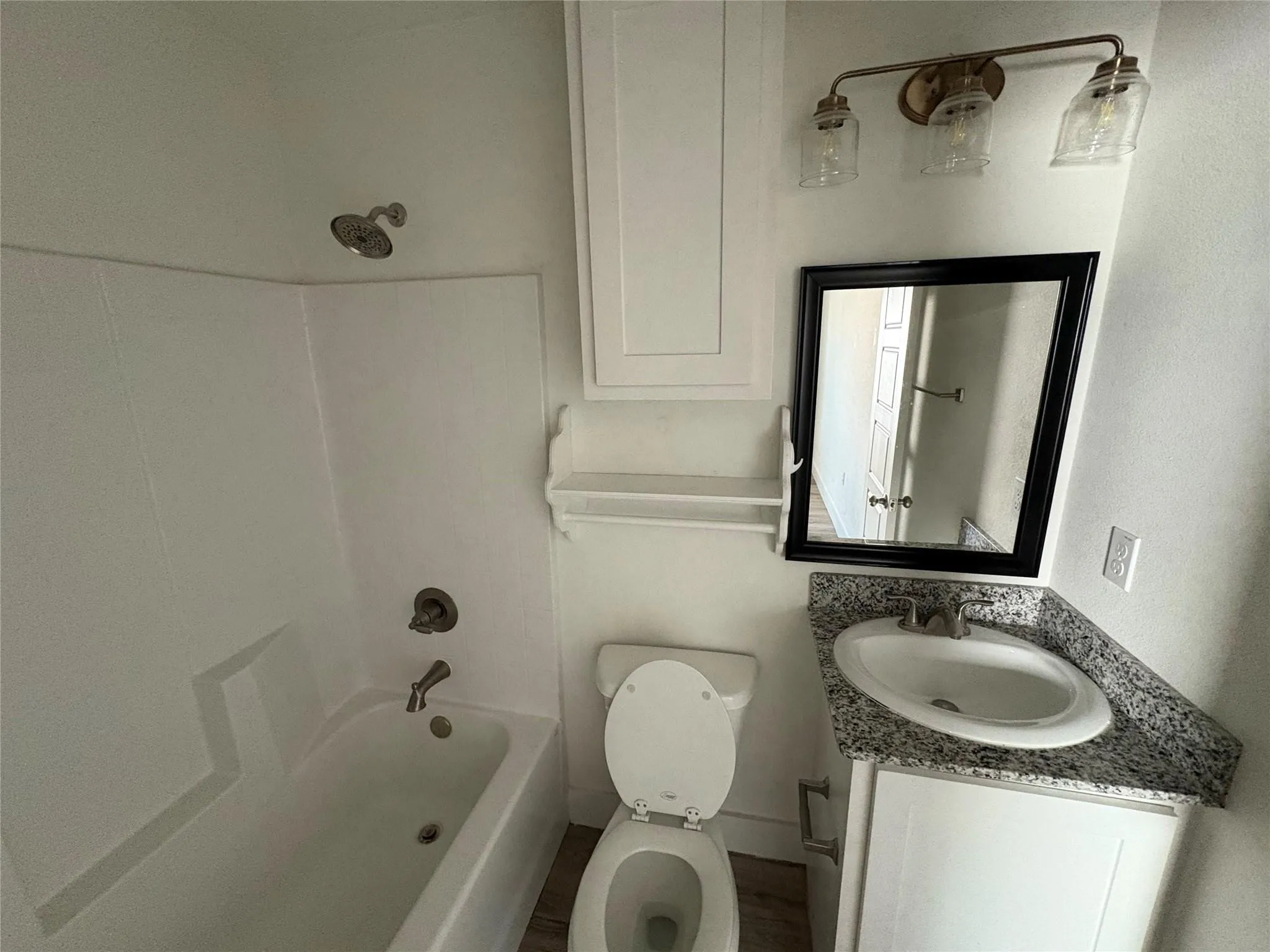 Tub/shower in bathroom and linen area