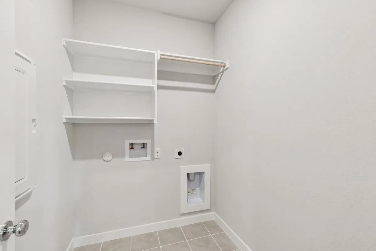 Utility Room in the Oscar home plan by Trophy Signature Homes – REPRESENTATIVE PHOTO