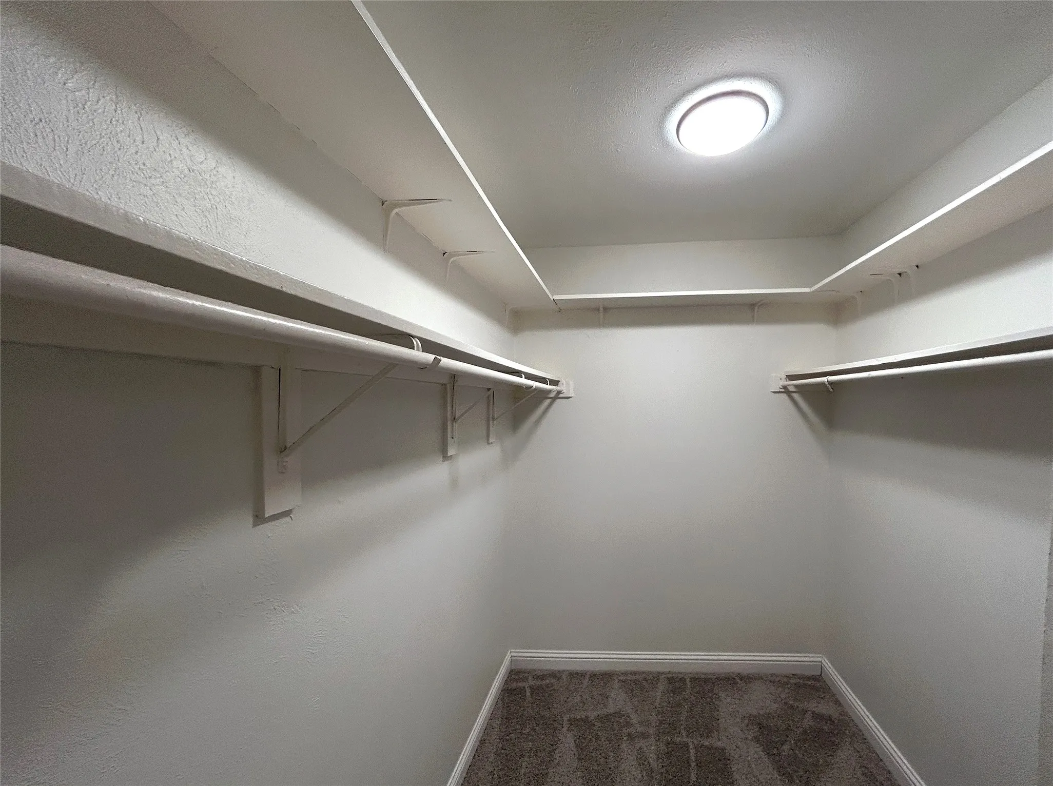 The primary bedroom has a walk-in closet. New carpet was installed in 2026.