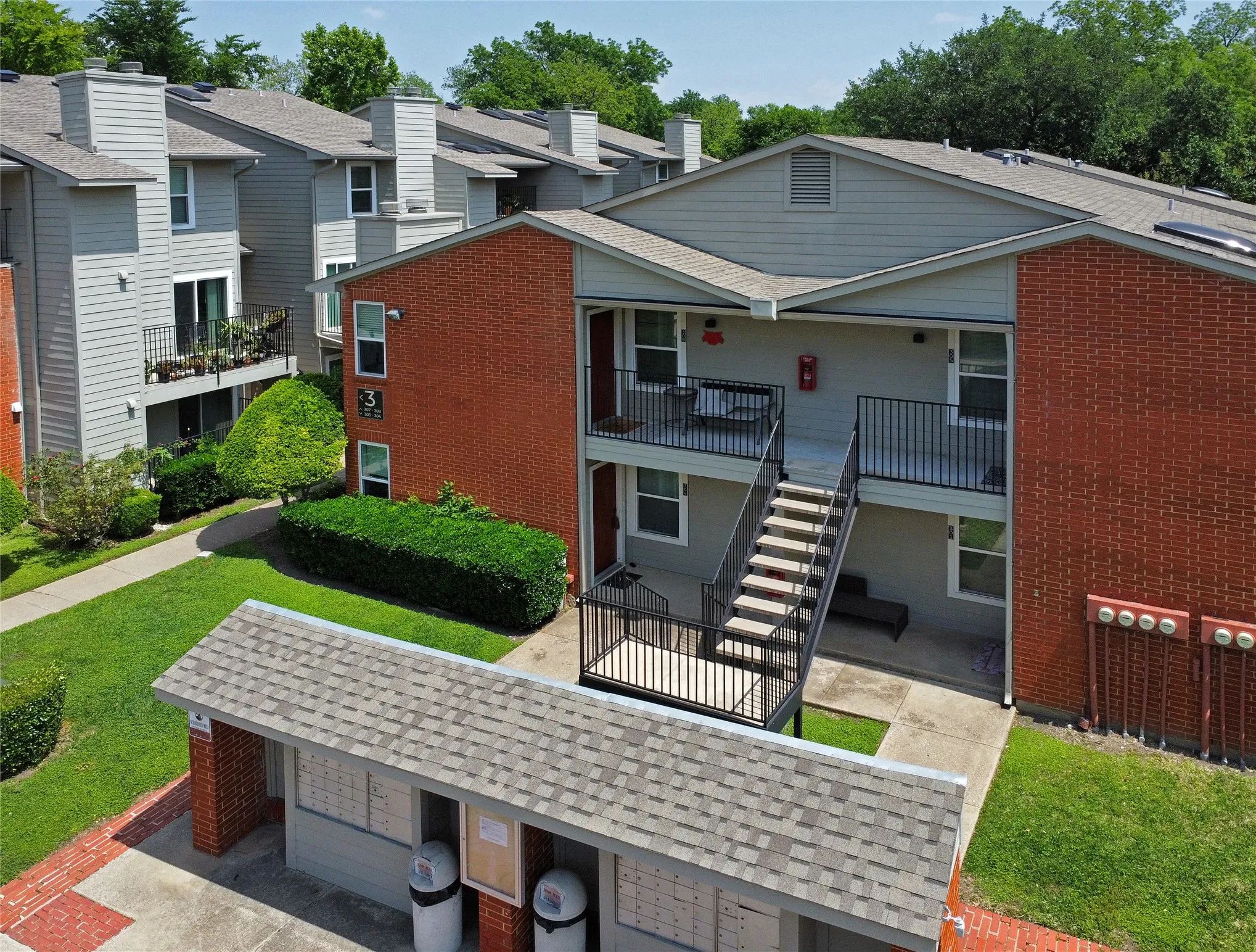 View of front entrance to the property. This unit is on the ground level and conveniently near the community mailboxes and pool.