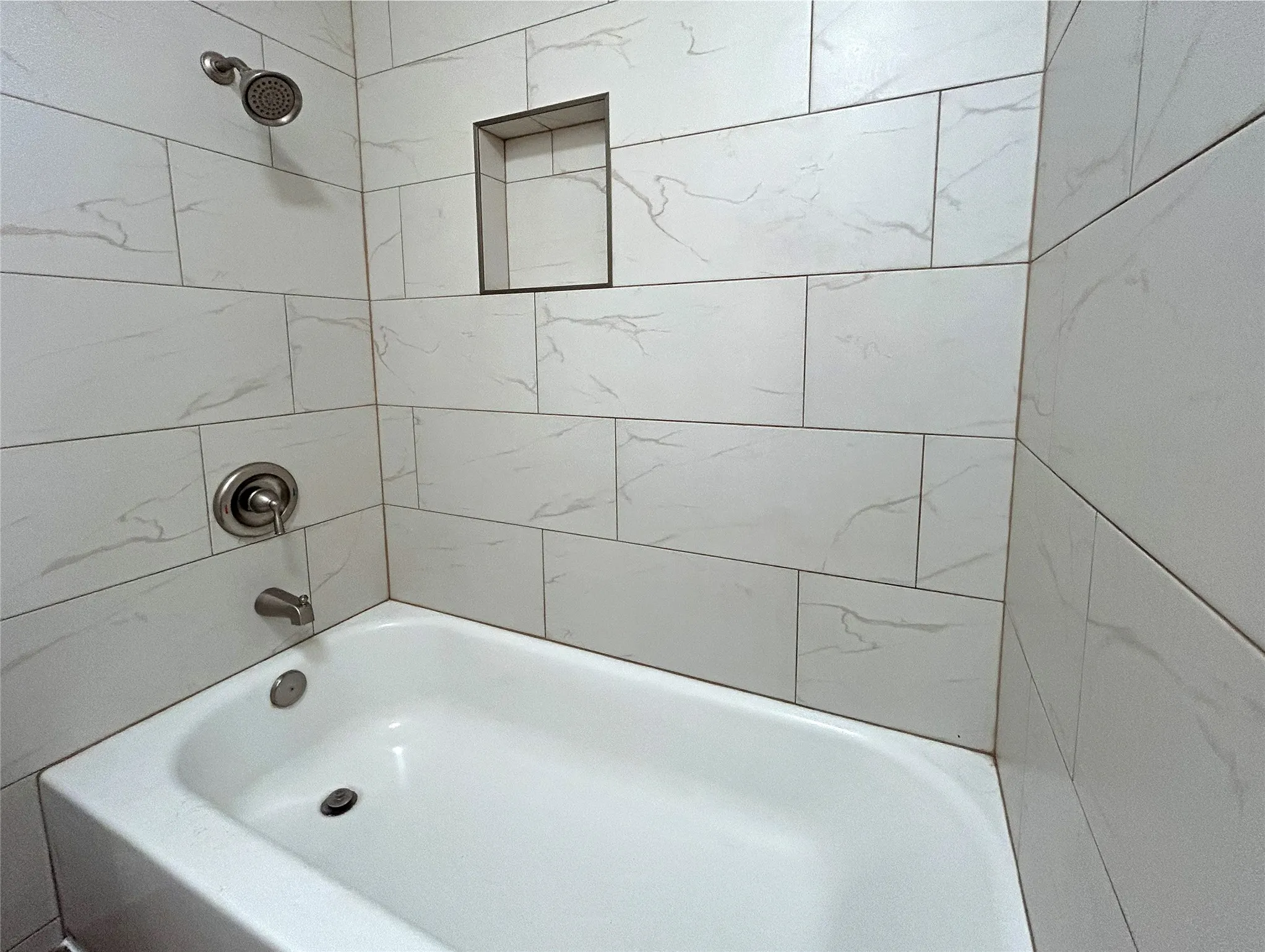 The primary bedroom has an ensuite bathroom with a bath/shower combo.