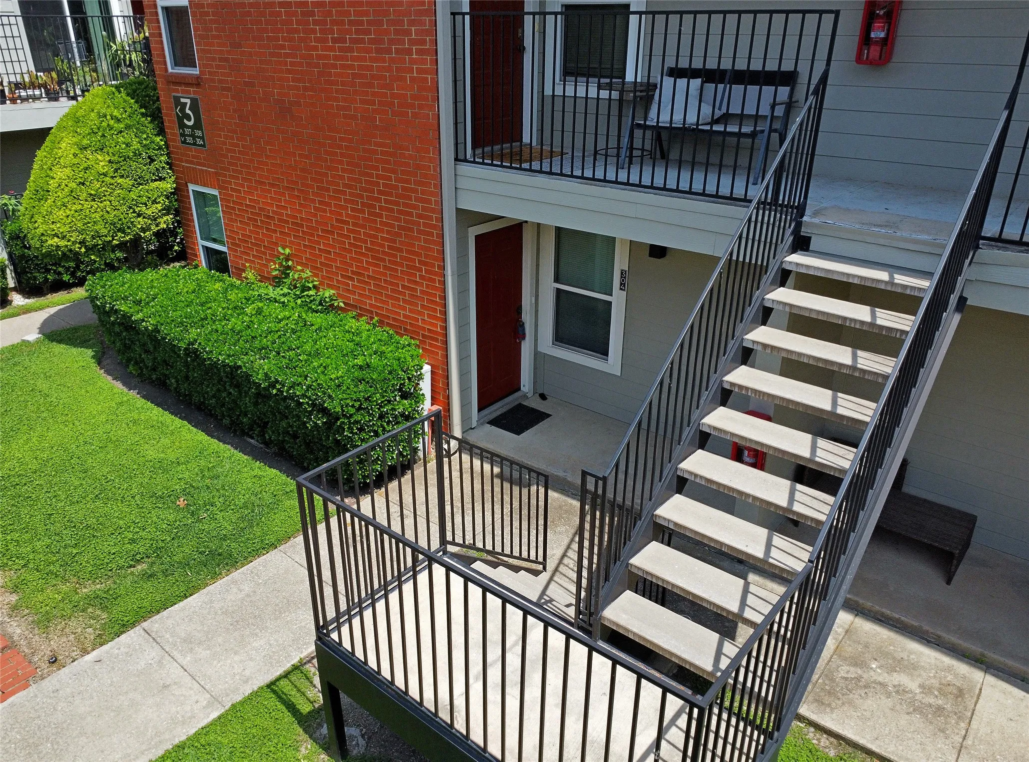 View of building front exterior. The condo is located entirely on the ground level.