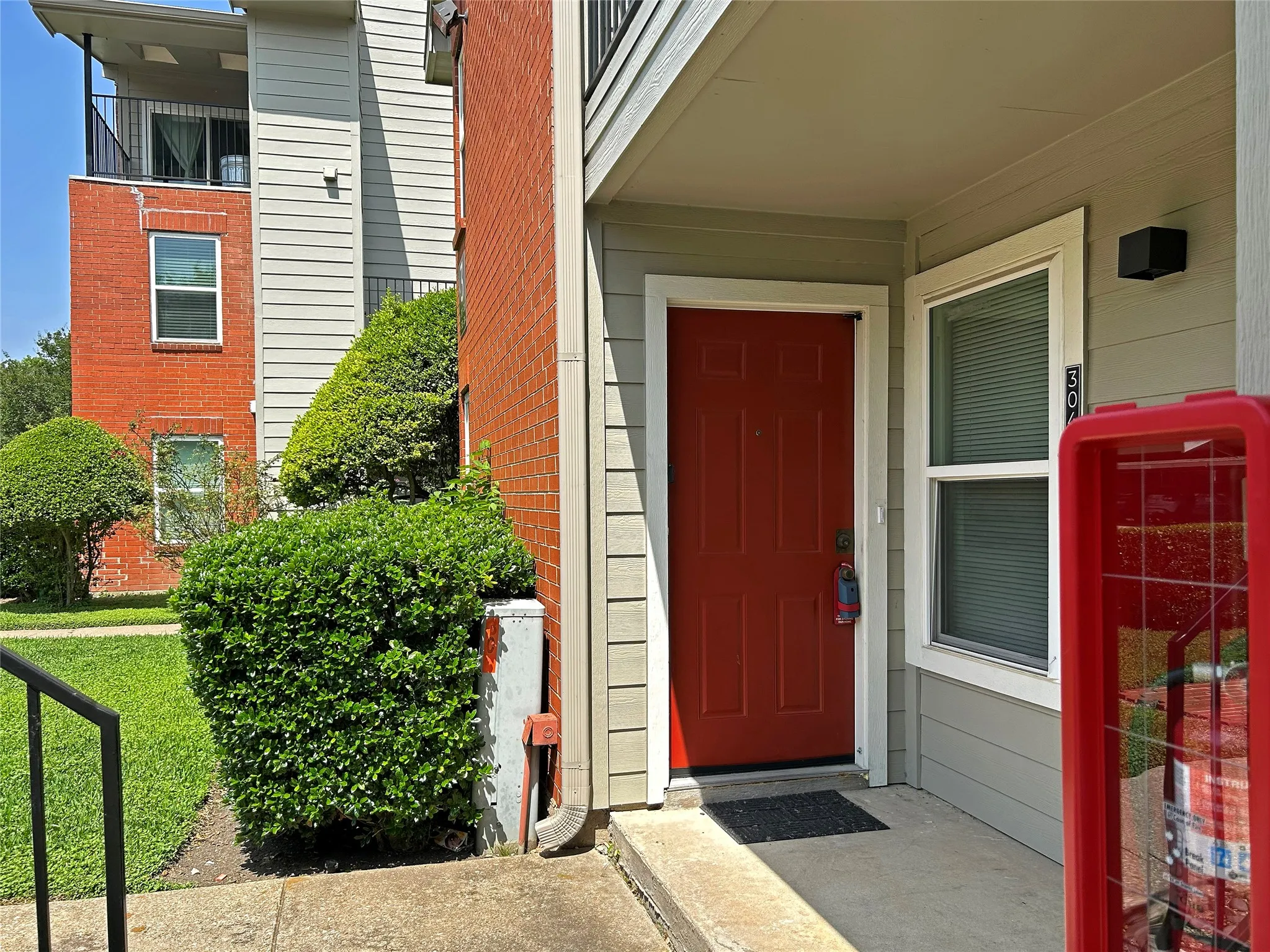 View of property entrance and freshly painted door.
