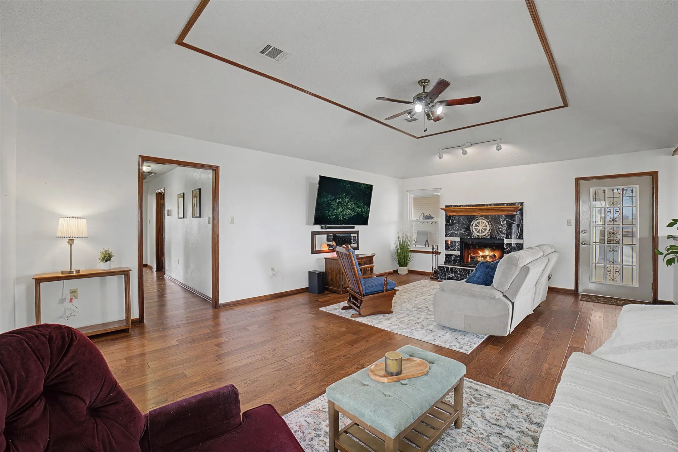 Living room facing backdoor and hallway