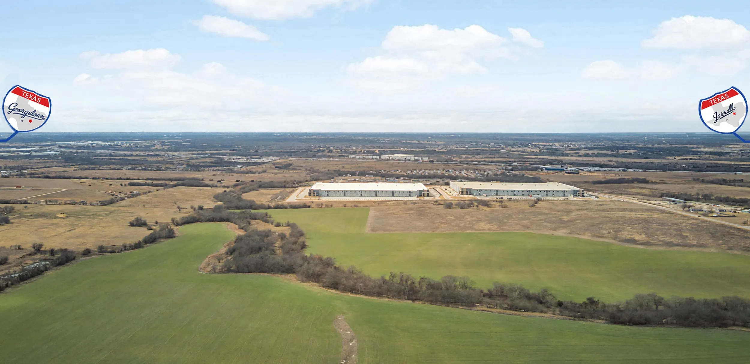 Aerial view facing west towards I-35 and various commercial businesses