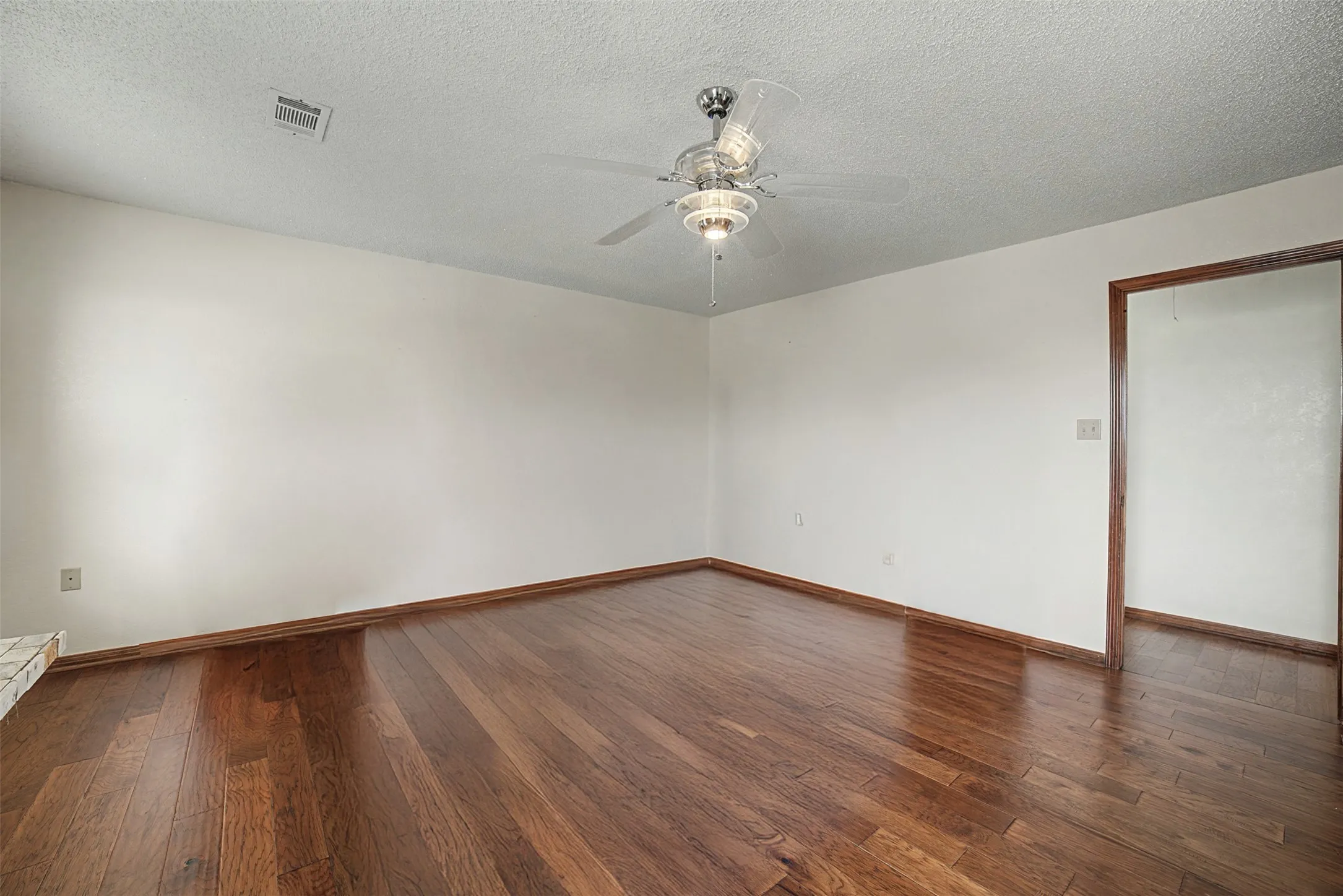 empty primary bedroom can be used for a variety of business needs. Virtually staged.