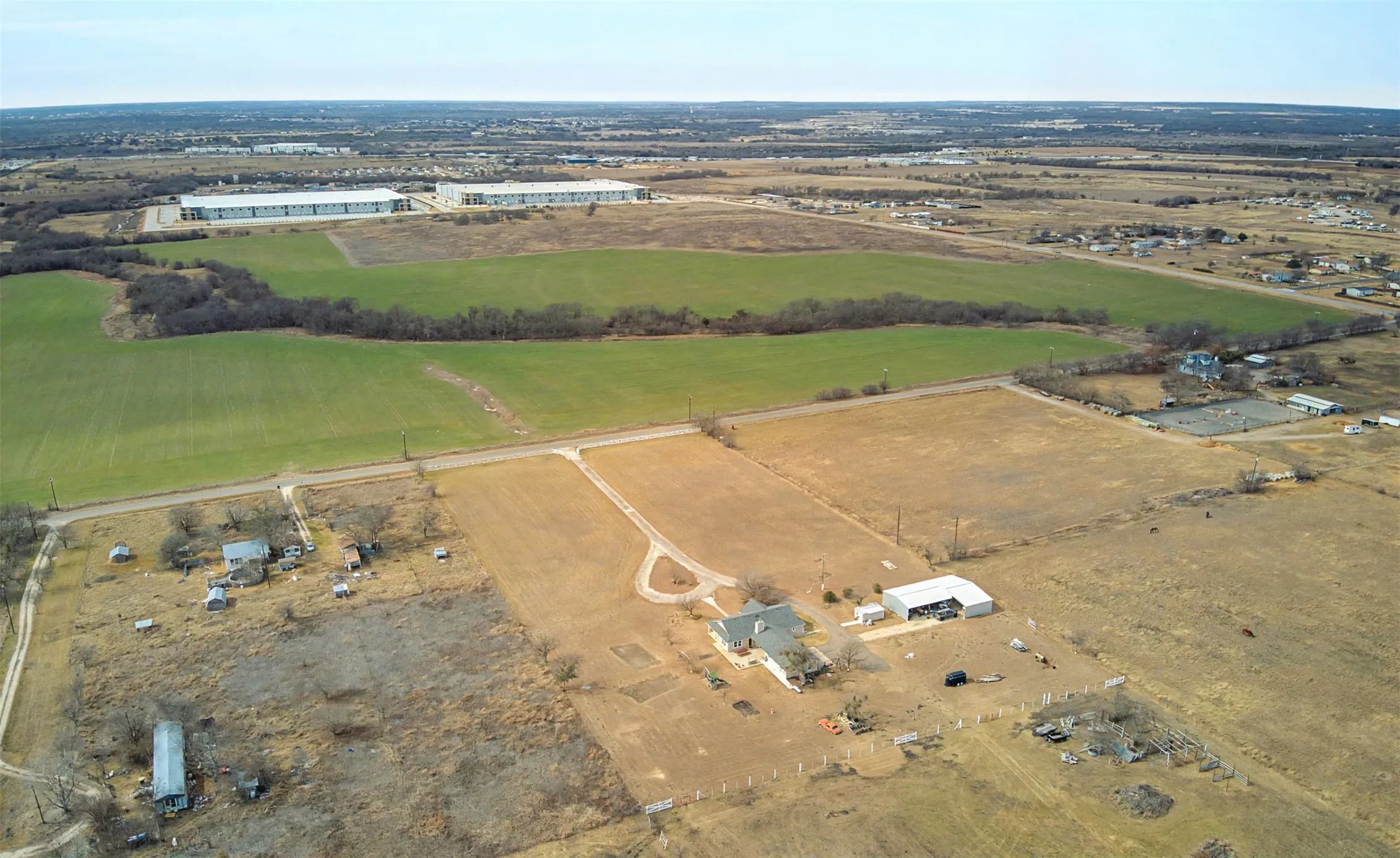 Aerial view from back left side of half of property