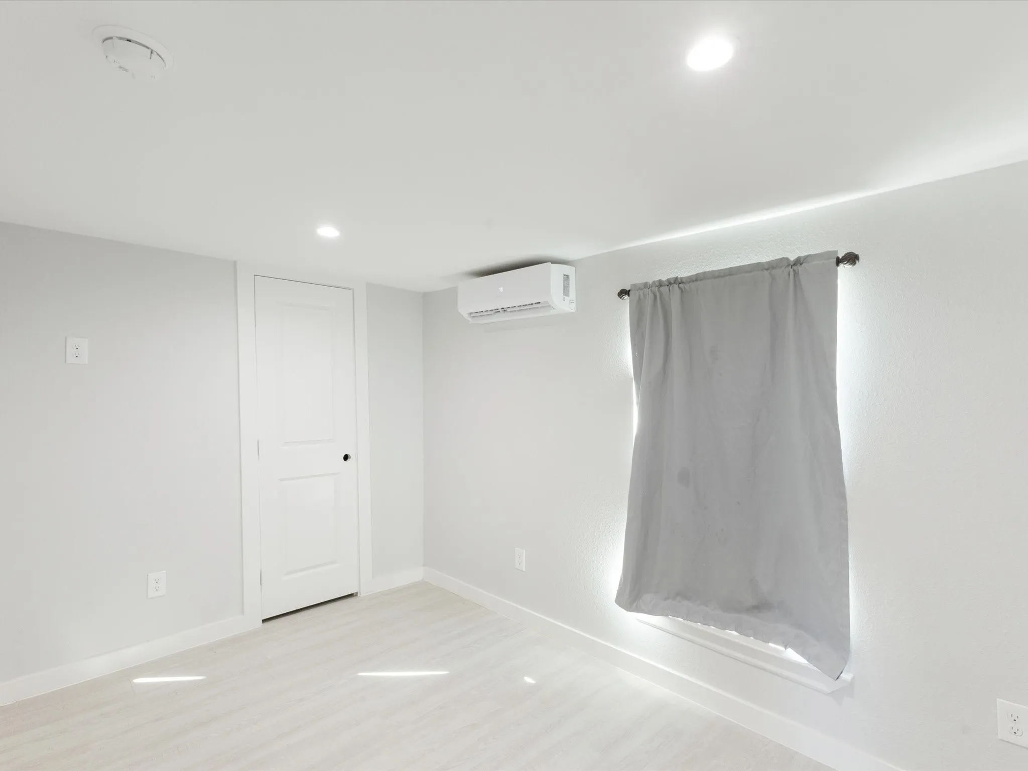 Spare room featuring recessed lighting and light wood-style floors