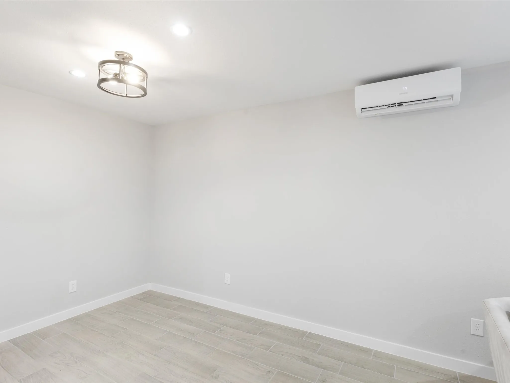 Unfurnished room featuring light wood finished floors and recessed lighting