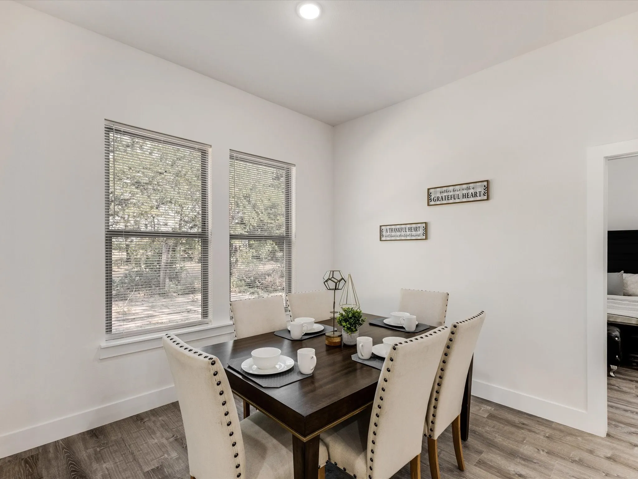 Dining space with light wood-type flooring and baseboards