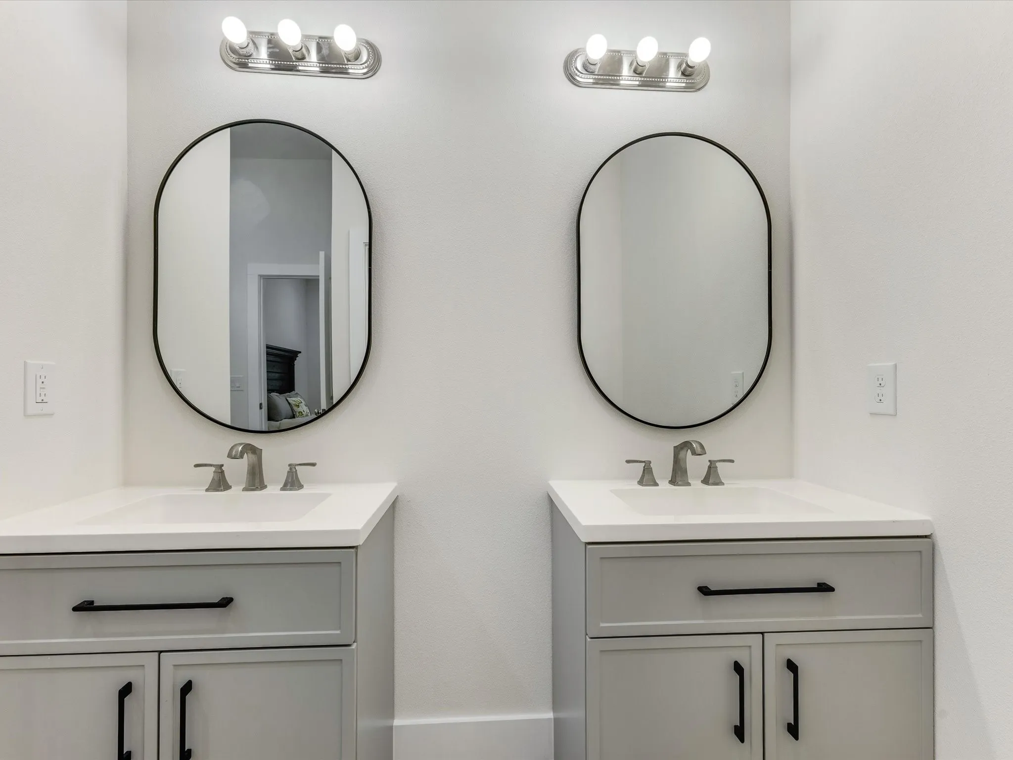 Full bathroom with two vanities