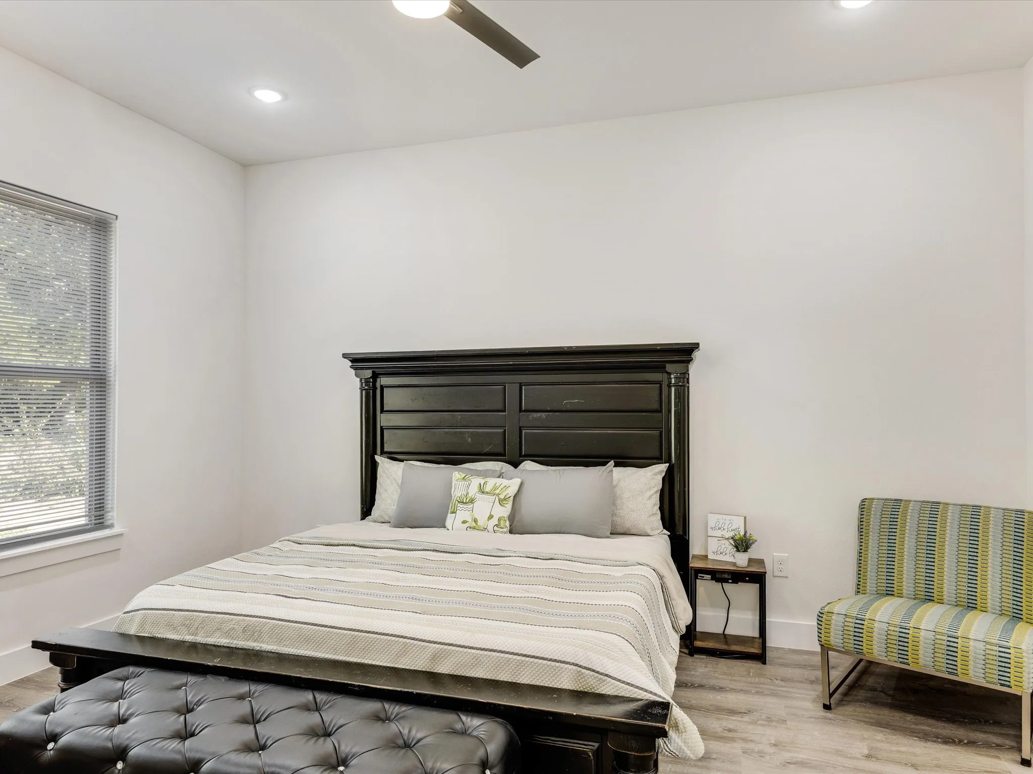Bedroom featuring light wood-type flooring, a ceiling fan, and recessed lighting