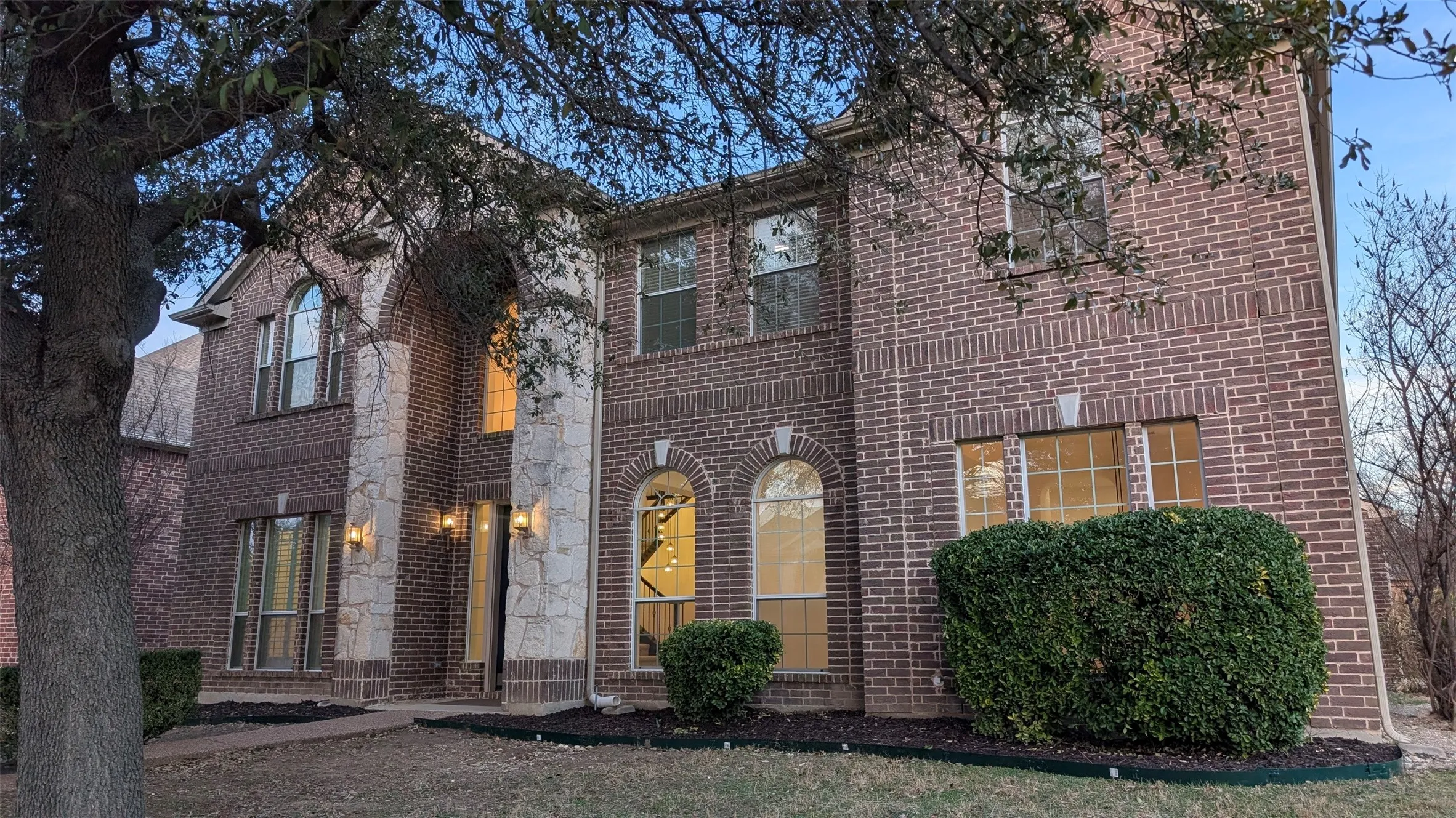 View of front of home with brick siding