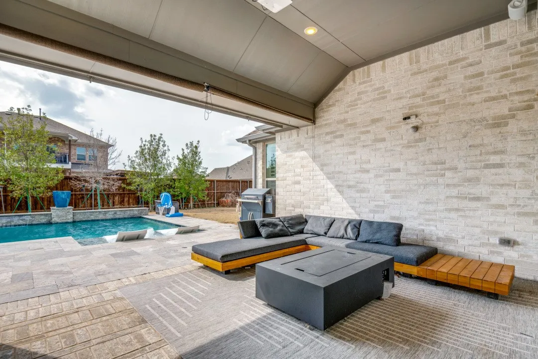 Fenced backyard featuring a patio area, area for grilling, and outdoor furniture