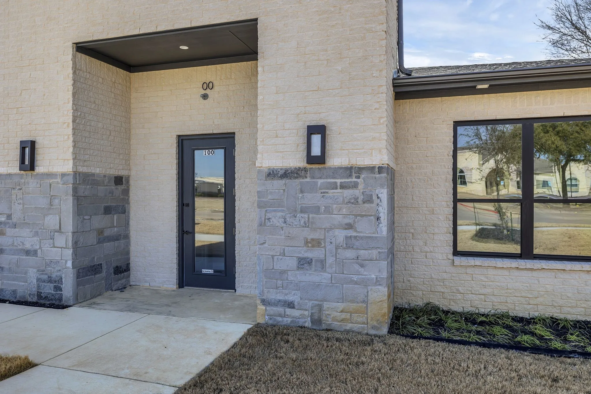 Property entrance with brick siding